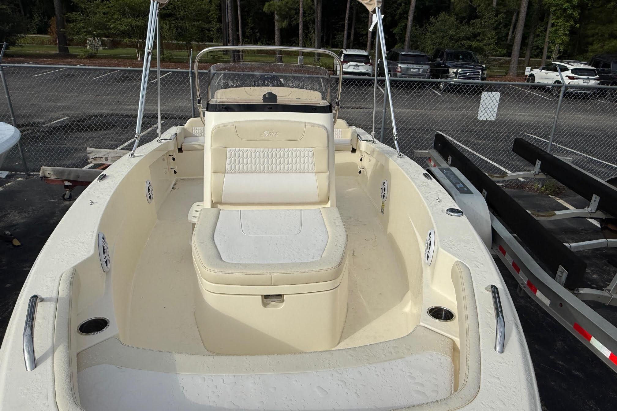 2026 Scout 188 Sportfish boat with beige interior, parked in a lot.