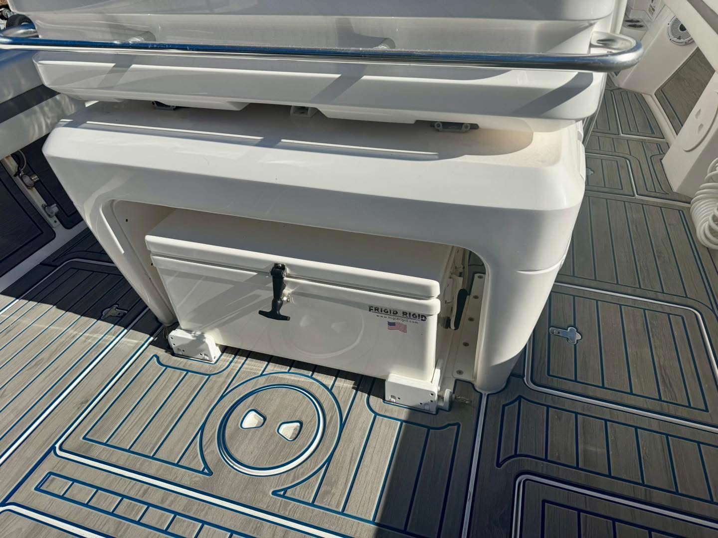 Intrepid 327 Nomad 2021 with Frigo Rigid cooler on boat deck.