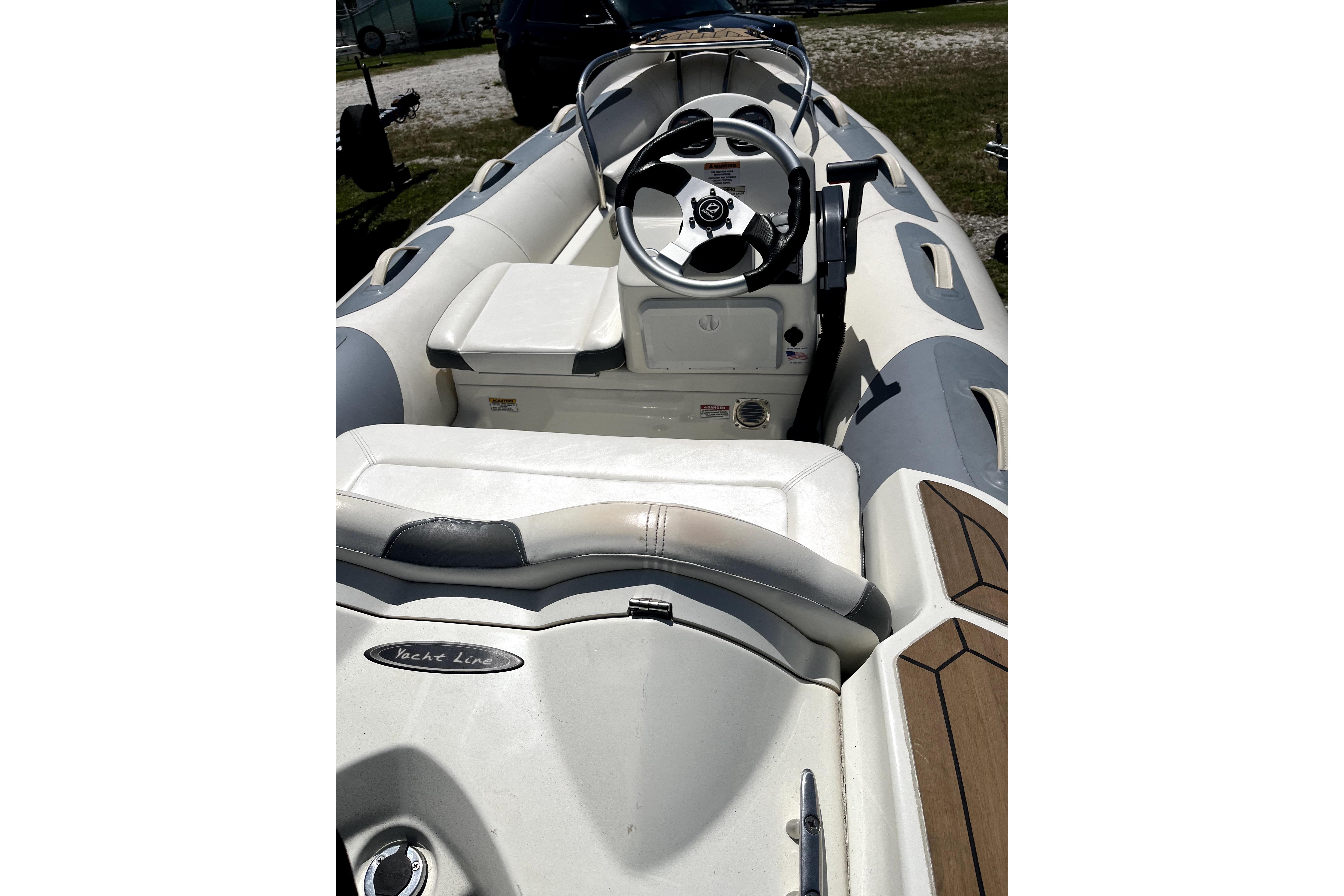 Interior view of a 2008 Sea Ray 60 Sundancer yacht with steering wheel and seating.