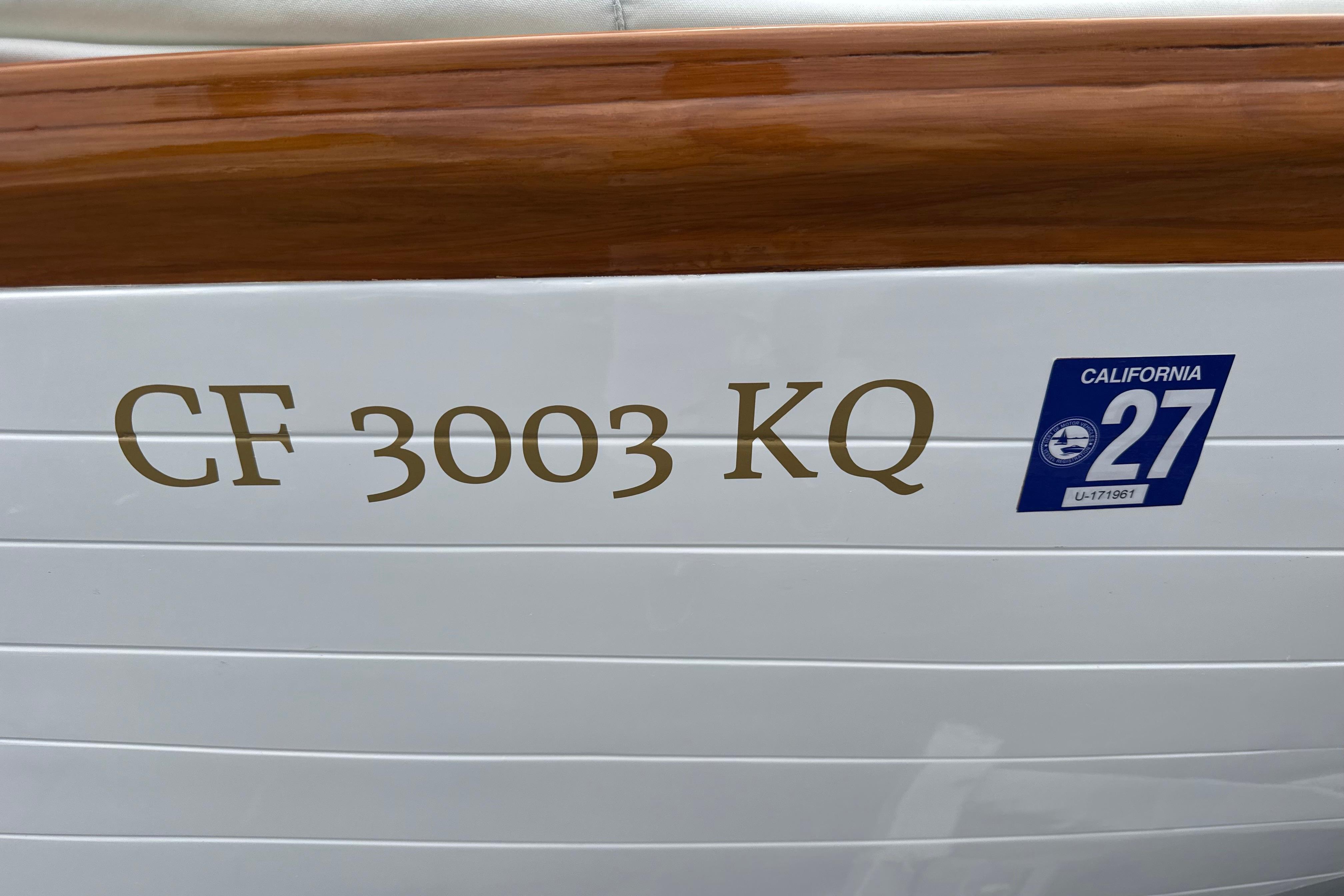 1920 Herreshoff 12.5 boat with California registration sticker and CF 3003 KQ number.