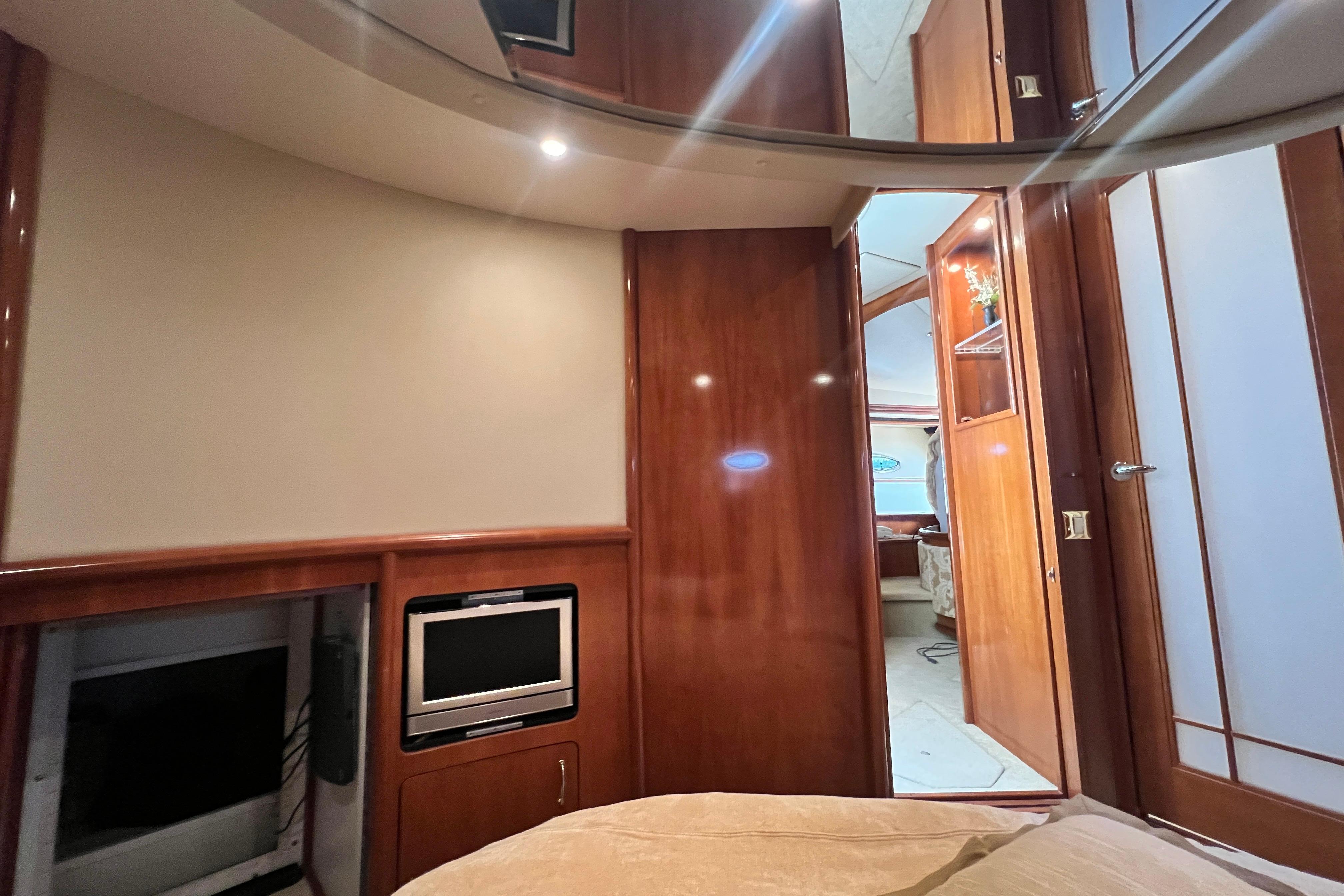 Interior of 2003 Carver 450 Voyager Pilothouse with wood paneling and built-in TV.