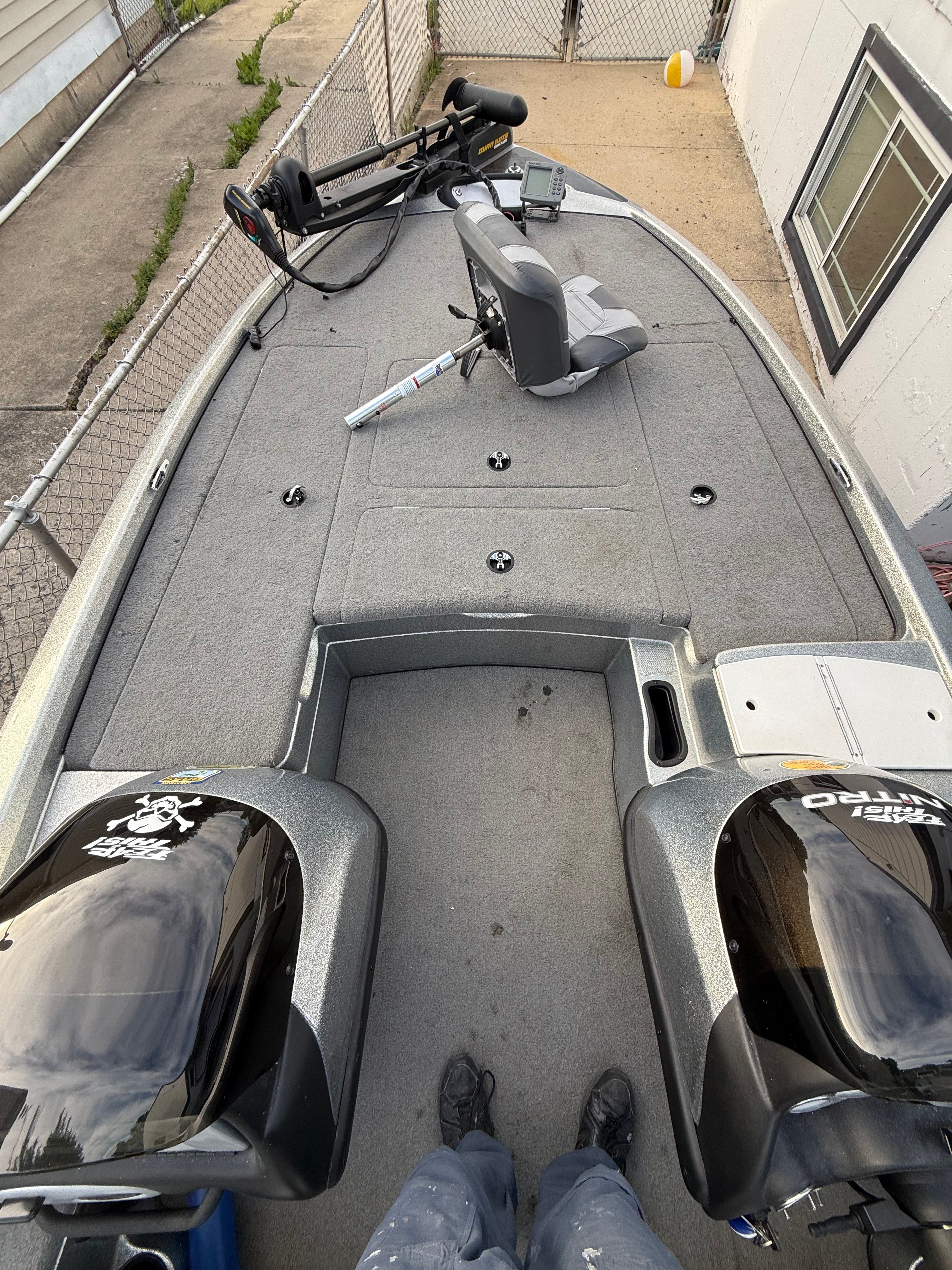 2004 Nitro NX 898 DC boat with gray deck and steering console.