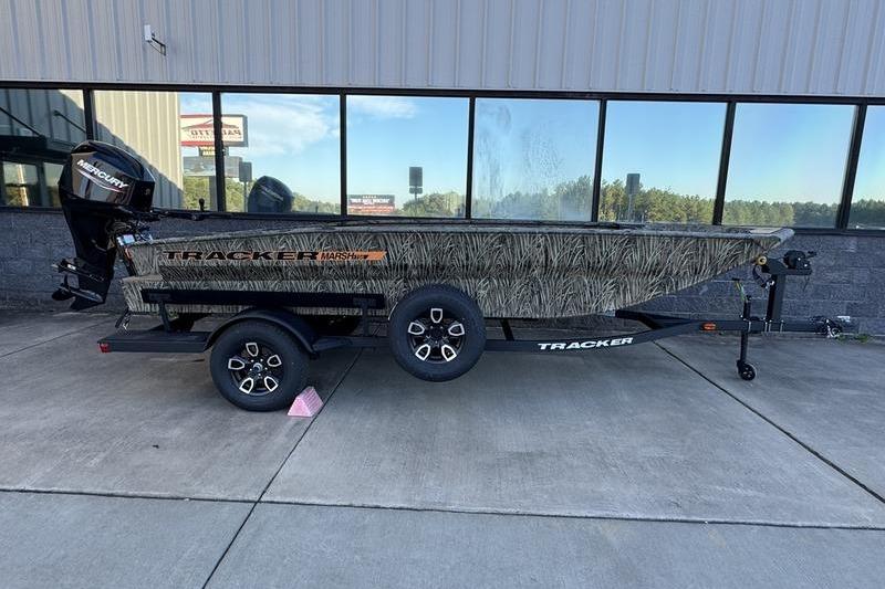 2026 Tracker Grizzly 1756 T Marsh boat with camouflage design on a trailer.