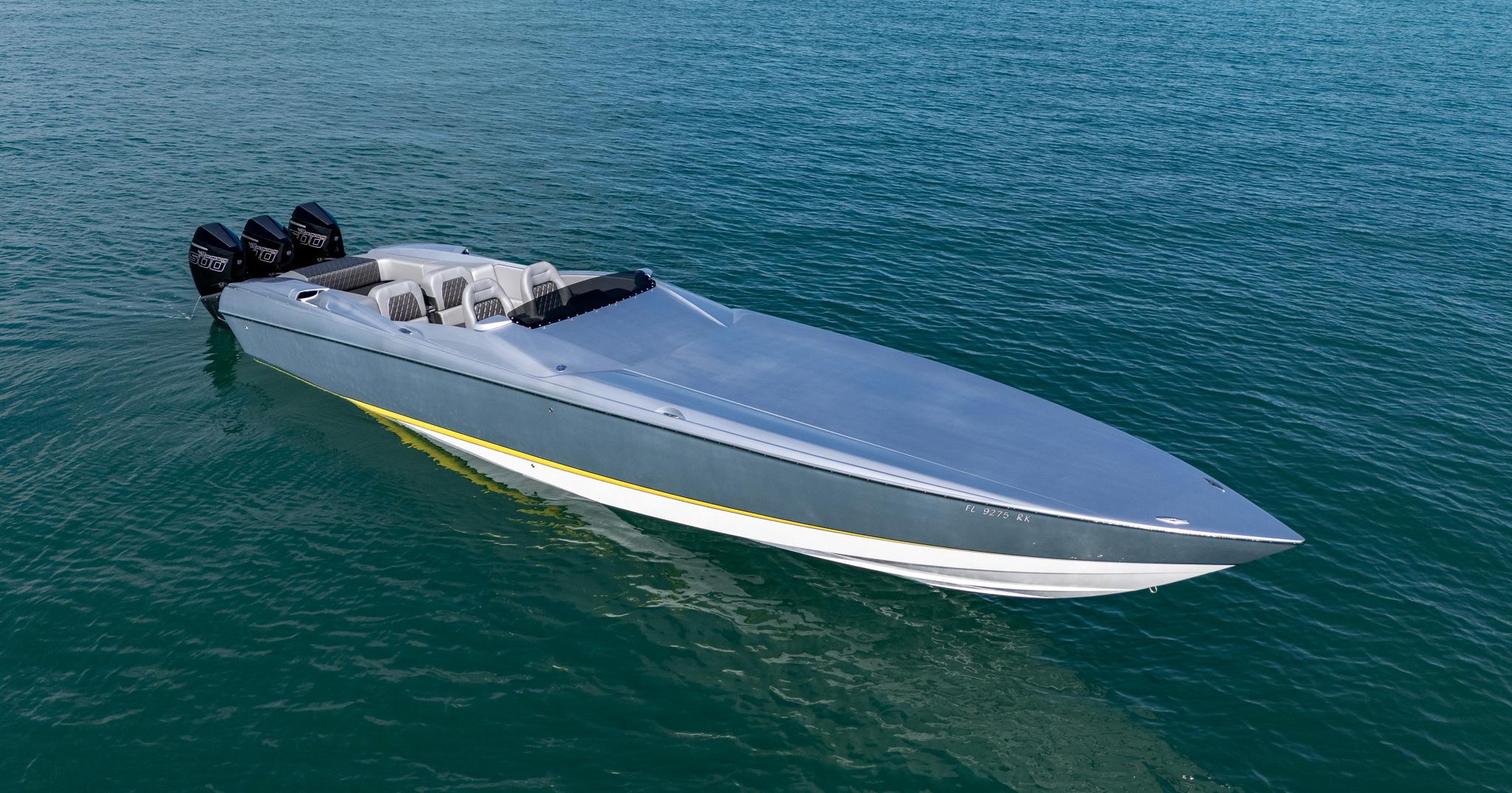 2017 Nor-Tech 3900 Super-VEE speedboat on calm blue water.