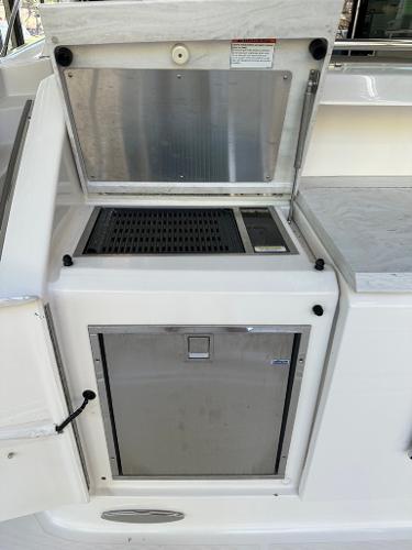 Outdoor grill and storage compartment on a 2019 Tiara Yachts C53.