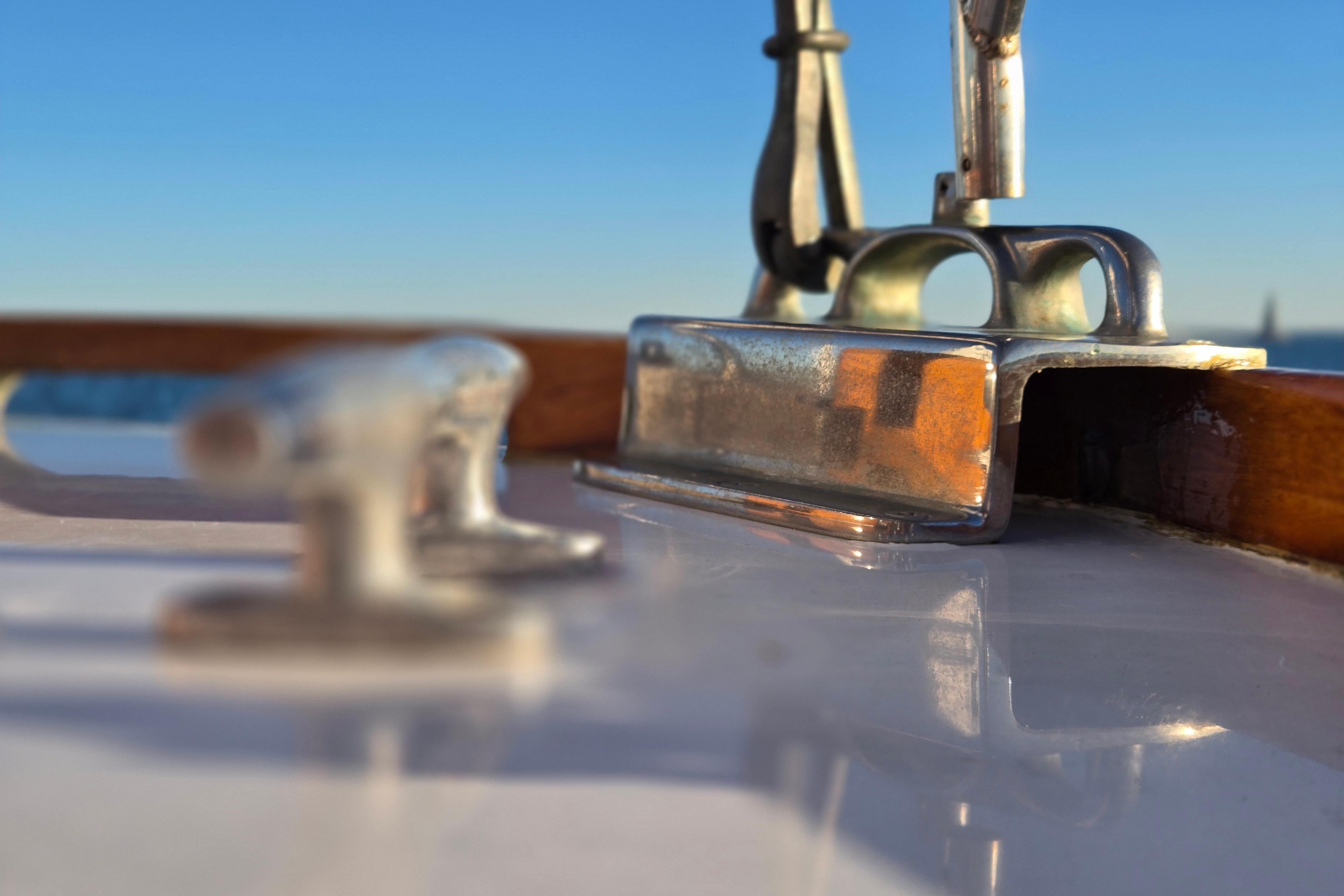 Close-up of a 1970 Hinckley Bermuda 40 yacht deck with metal fittings.