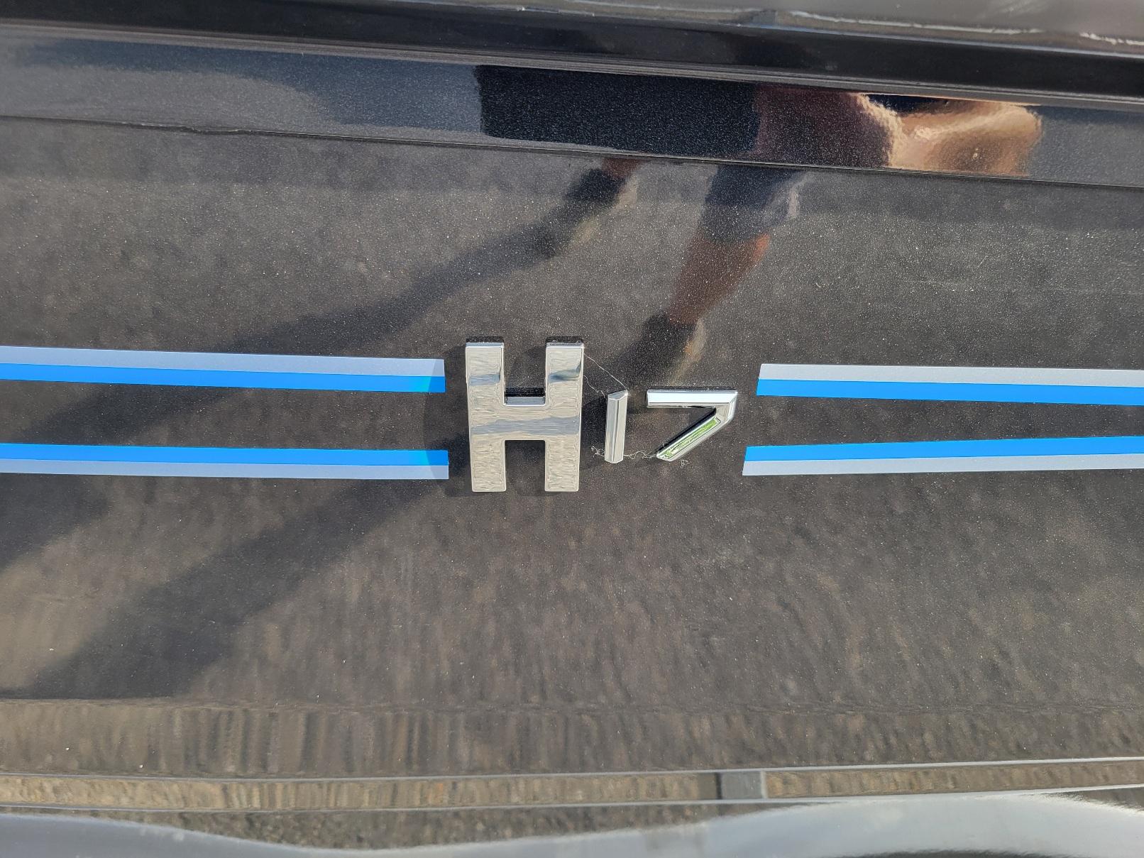 2025 Xpress H17C Crappie boat logo with blue stripes.