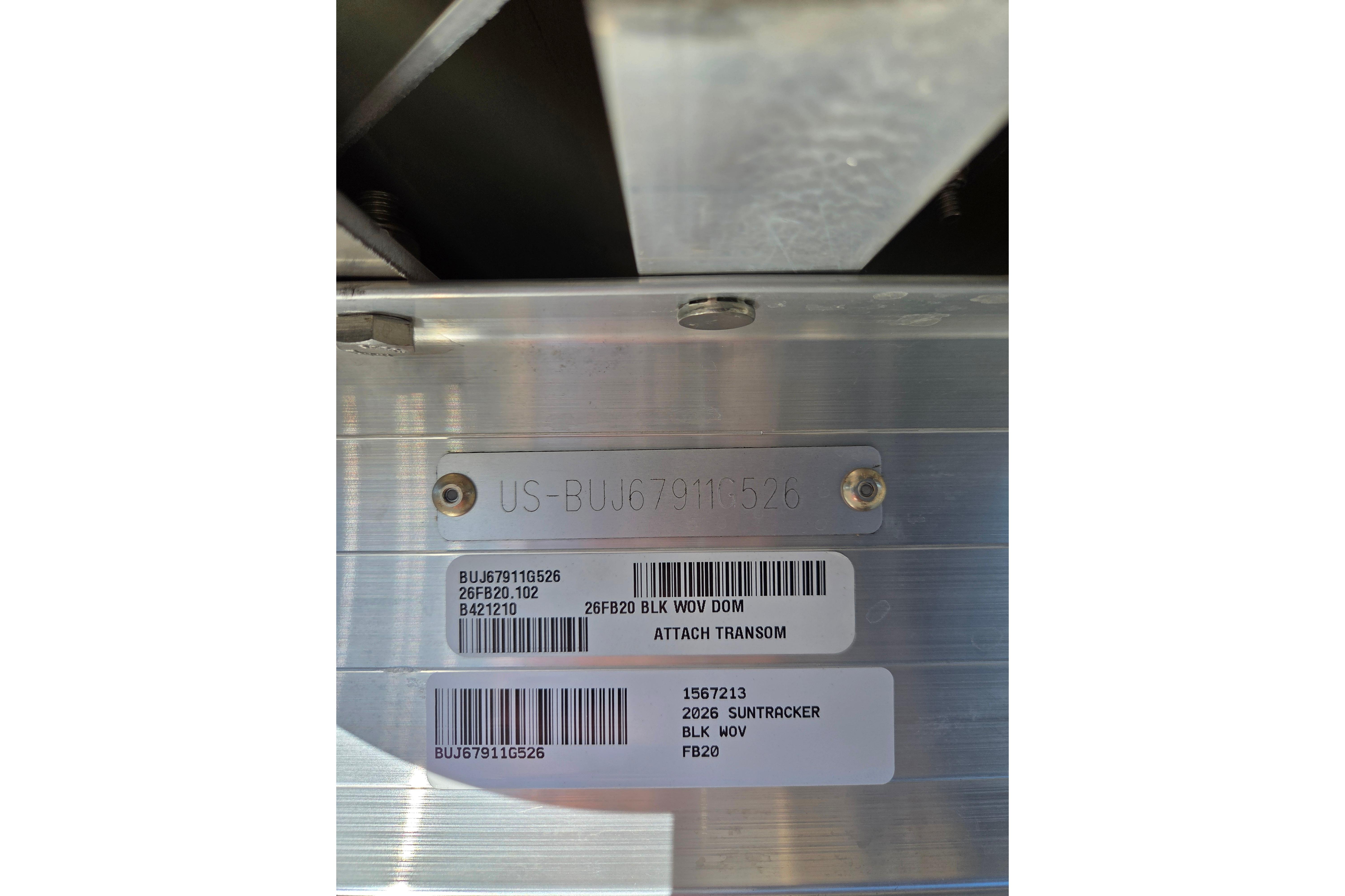 2026 Sun Tracker Fishin' Barge 20 DLX identification plate with serial numbers and barcodes.