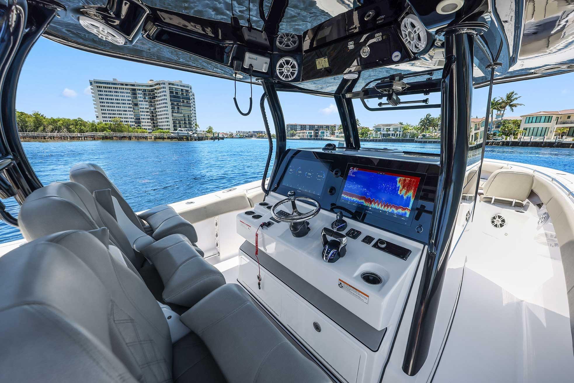 2024 Sportsman Open 352 Center Console boat interior with advanced navigation system on a sunny day.