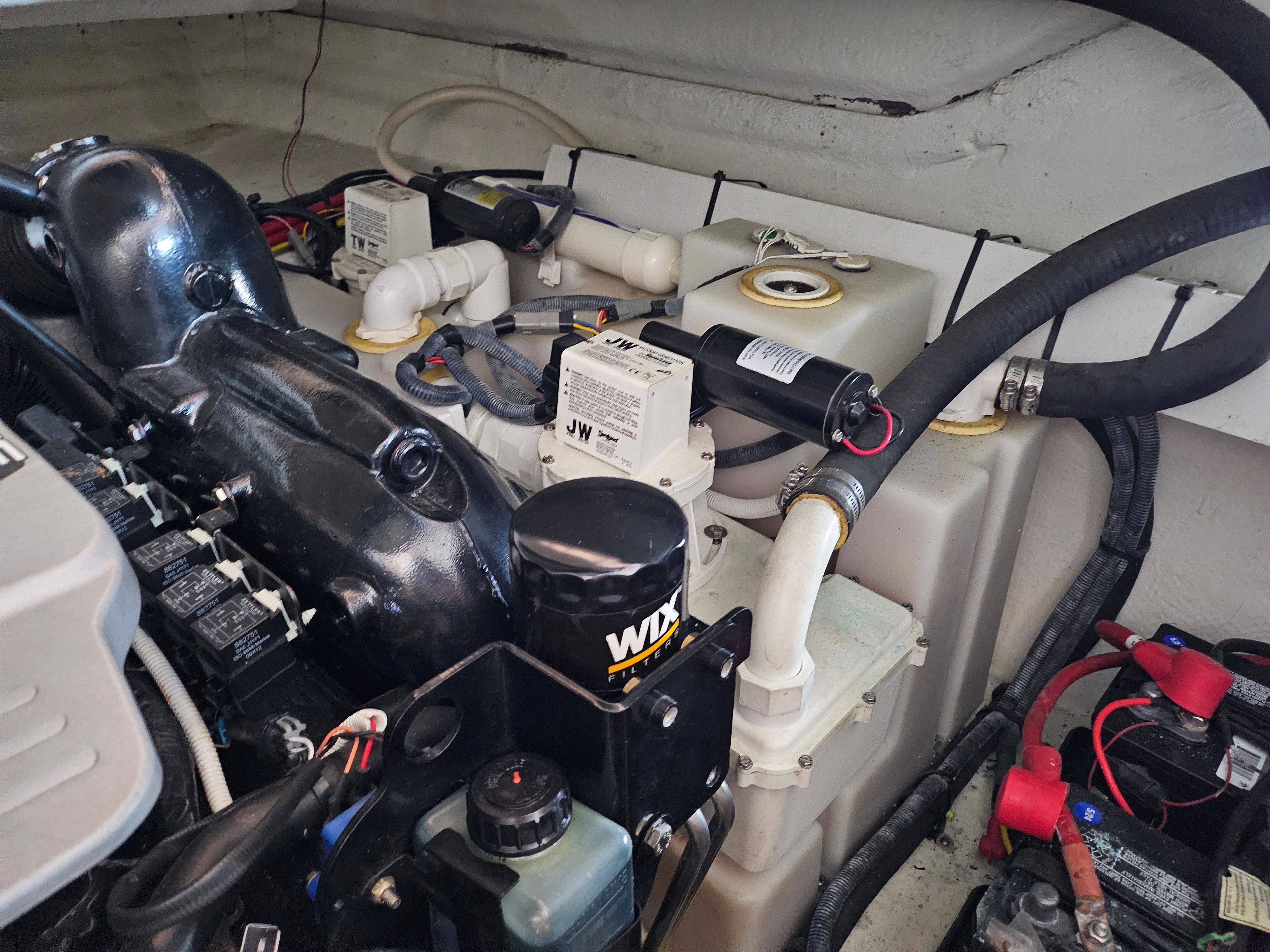 Engine compartment of 2014 Chaparral 330 Signature with technical components.
