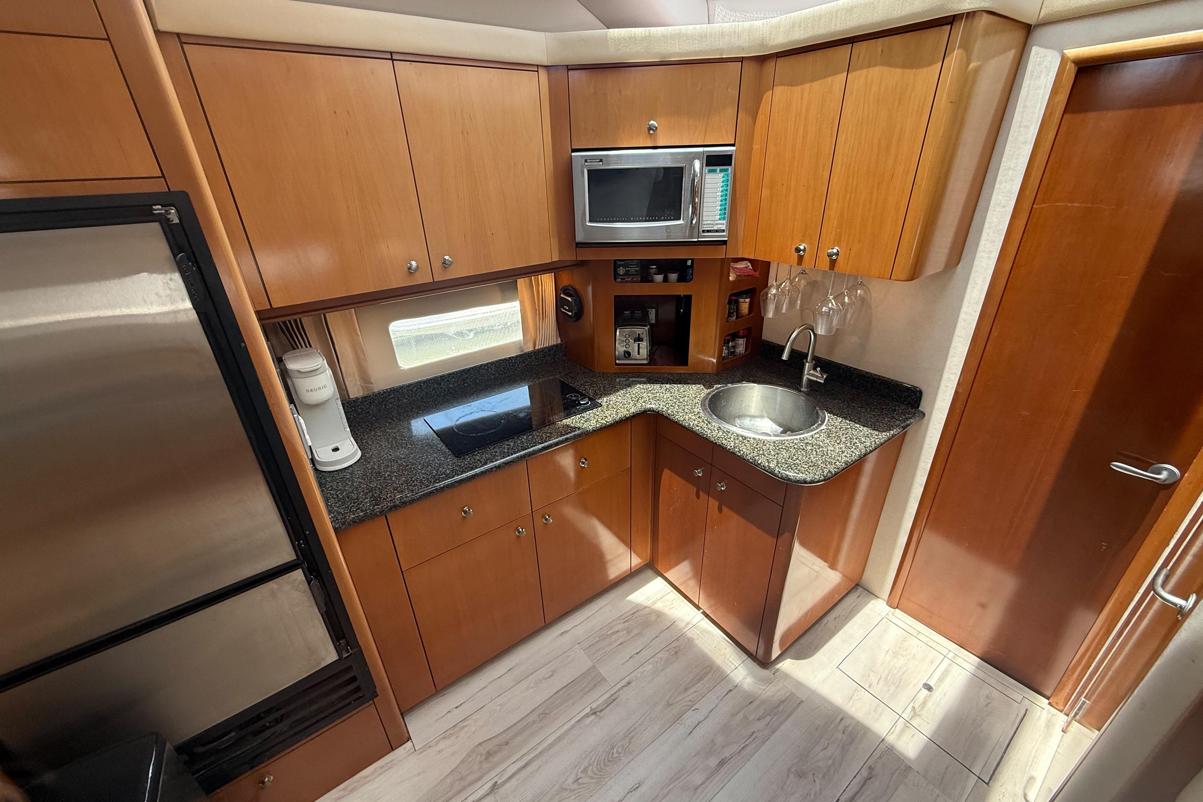 Kitchen area of a 2006 Carver 43 Motor Yacht with modern appliances.