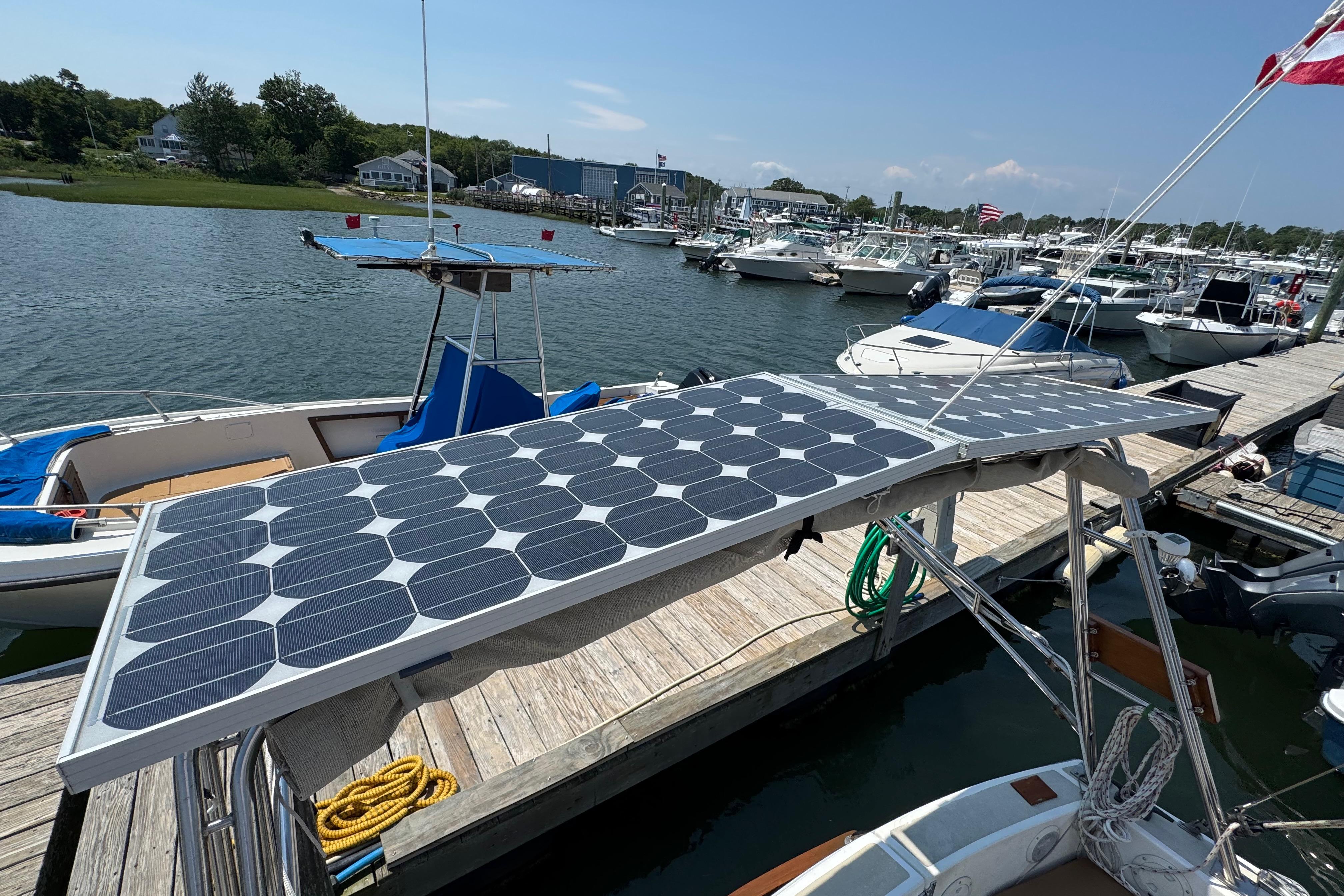 Cape Dory 30 Motorsailer with solar panels docked at a marina, 1989 model.