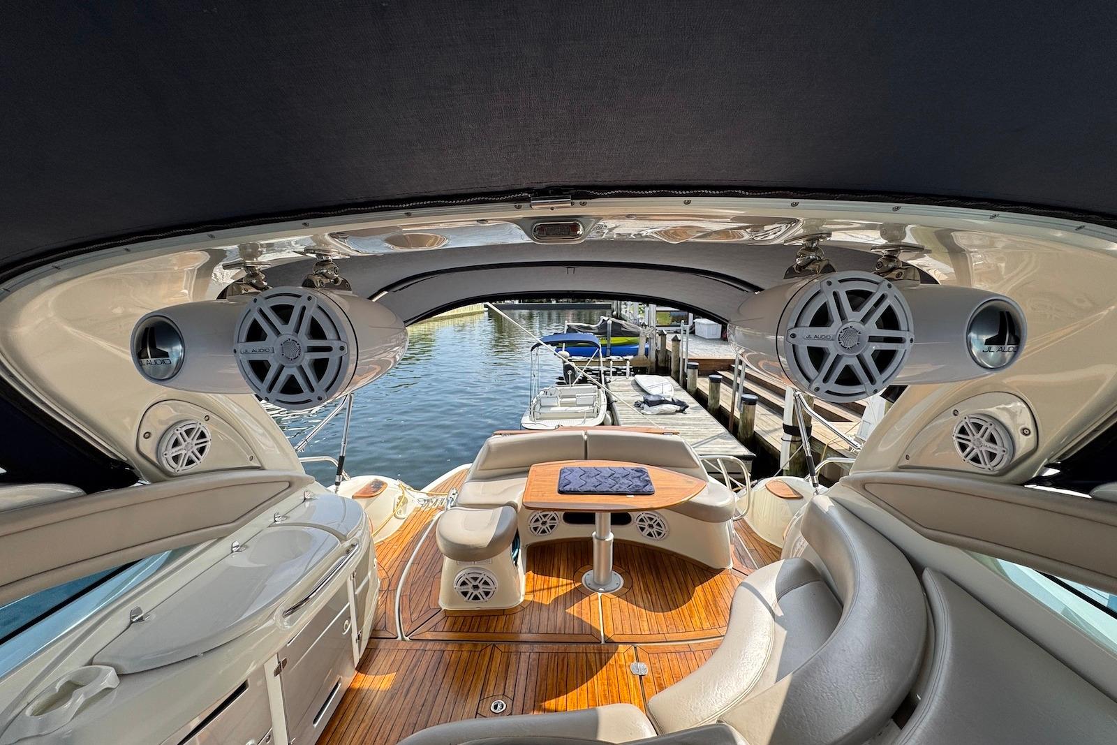 Luxurious 2009 Cranchi Mediterranee 43 yacht interior with plush seating and modern sound system.