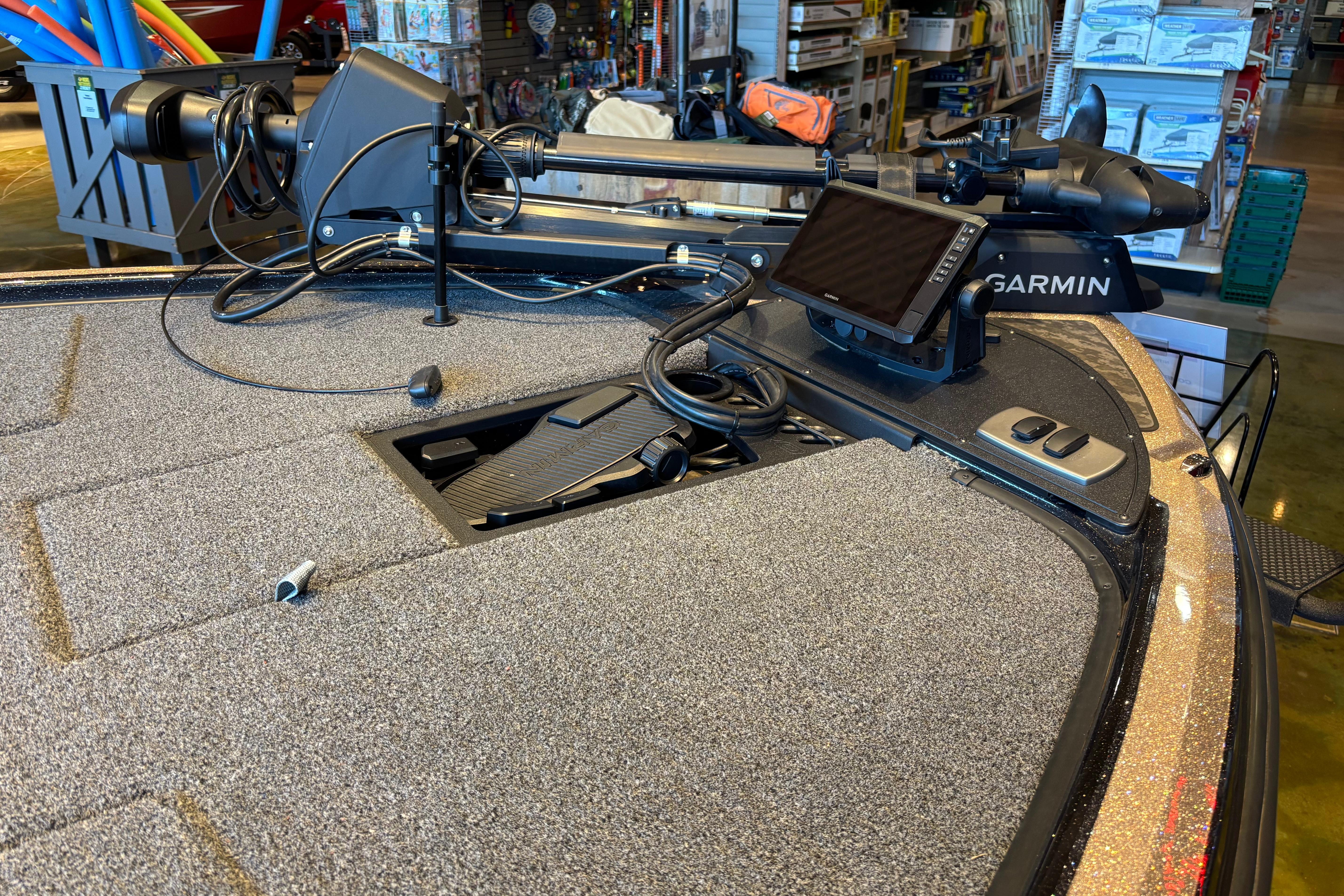 2026 Nitro Z19 XL Pro boat with Garmin electronics and trolling motor in a showroom.