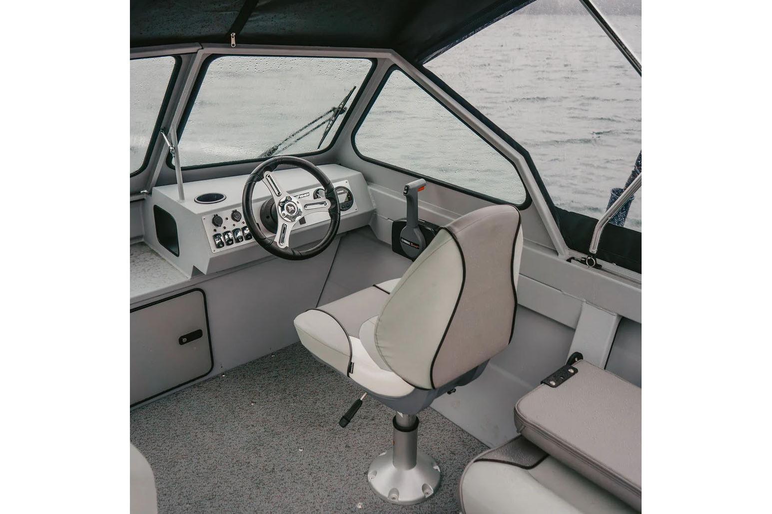 Manufacturer Provided Image: Interior of 2026 KingFisher 16 Falcon boat with steering wheel and seat.