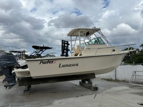 A 2008 Parker 2310 Walkaround boat is on a stand on land.