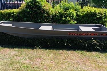 2026 Tracker Grizzly 14 Jon boat displayed outdoors on grass.