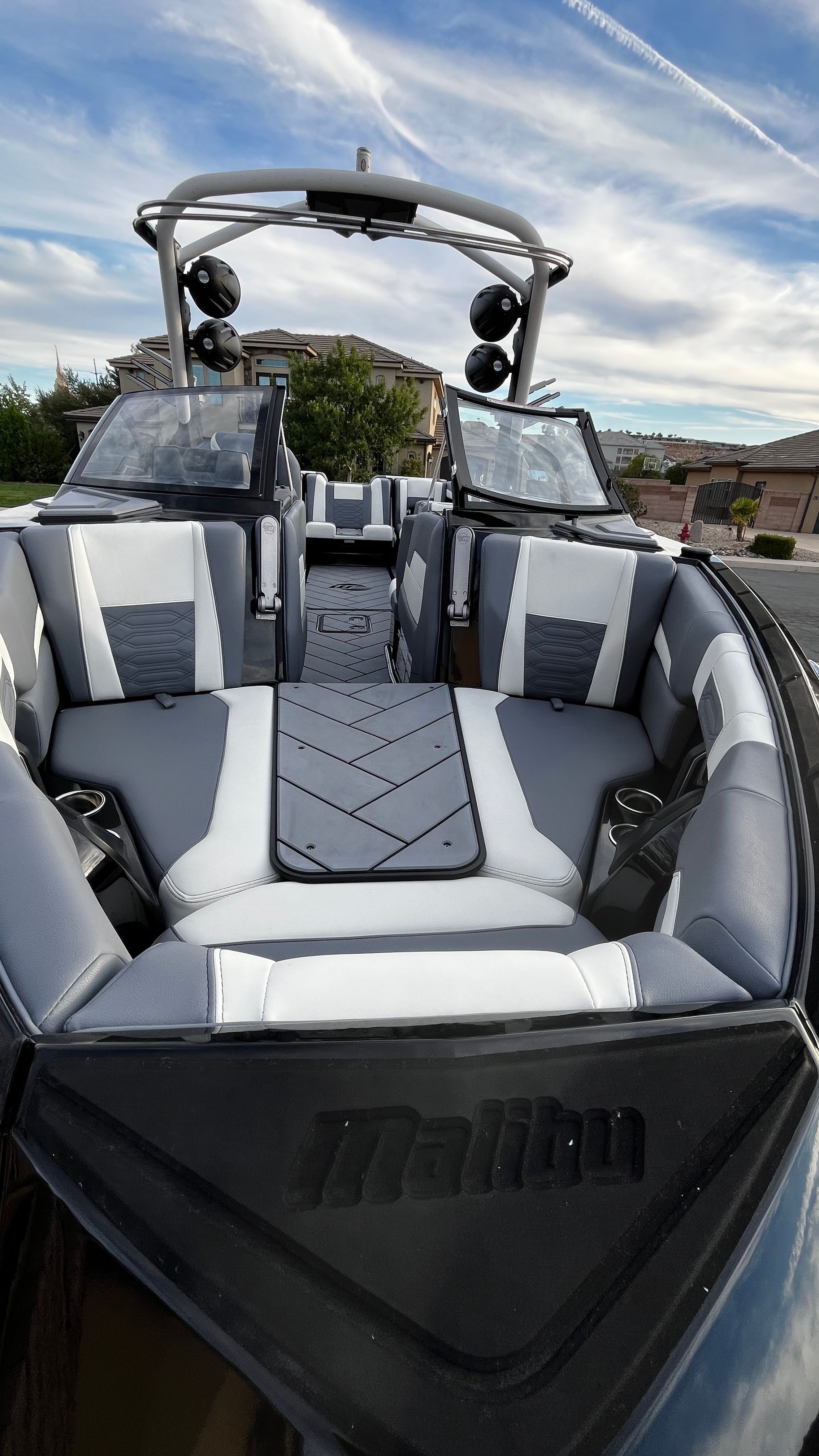 The image shows the interior of a 2023 Malibu Wakesetter 26 LSV with gray and white seating.