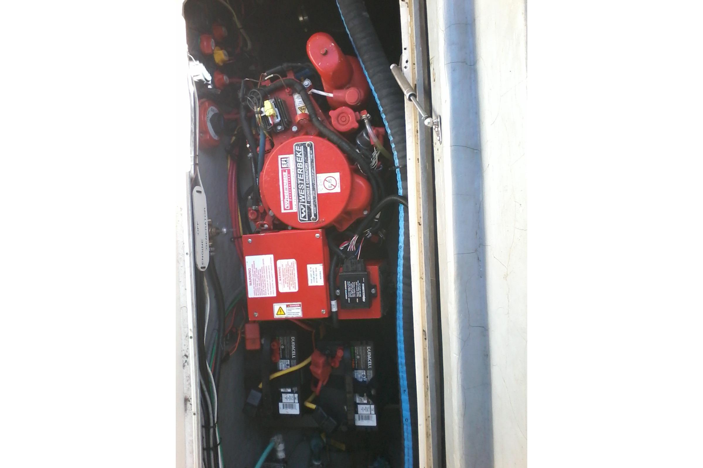 Engine compartment of 2002 Albemarle 265 Express Fisherman boat with visible wiring and components.