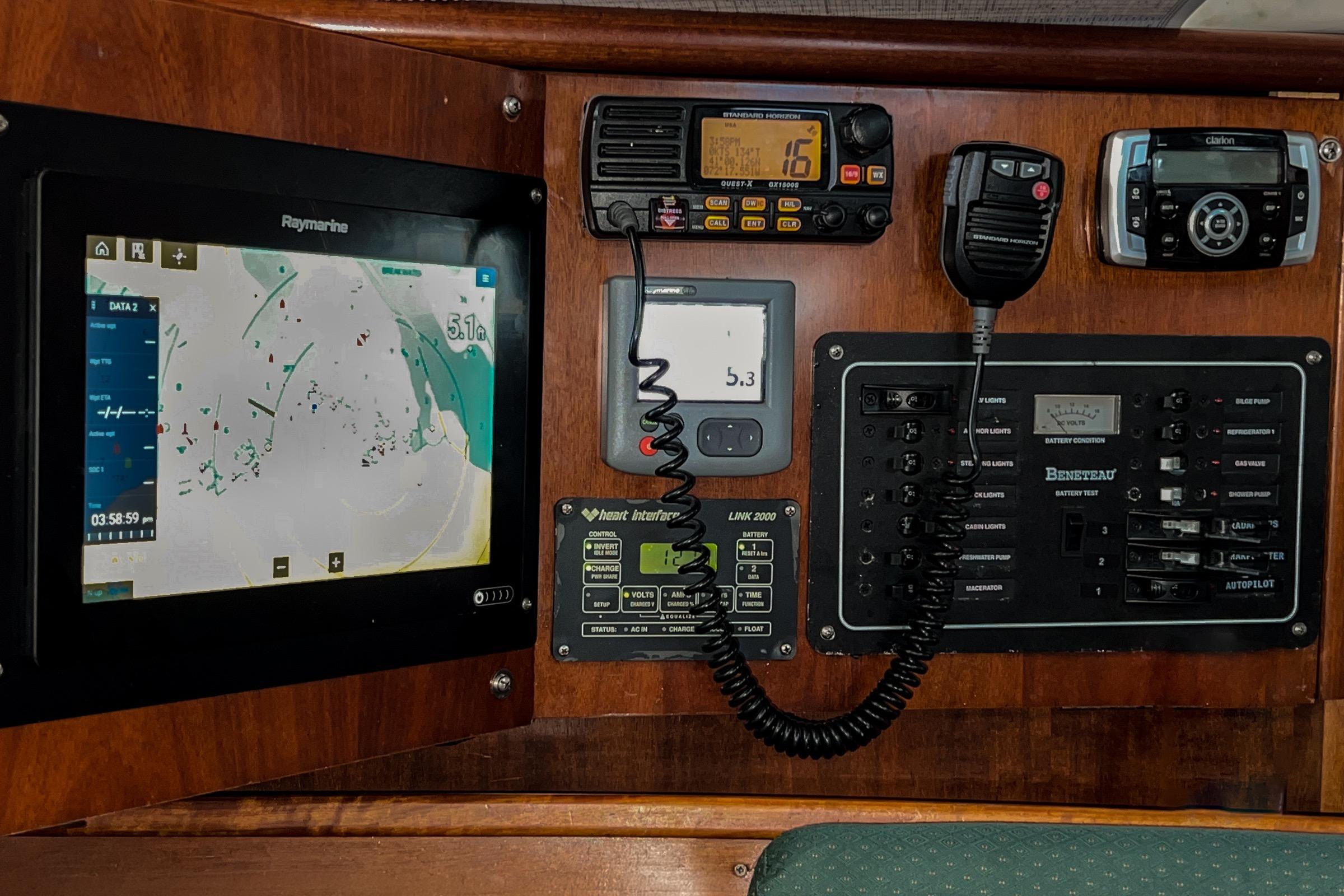 Control panel of a 2001 Beneteau 331 sailboat with navigation and communication equipment.