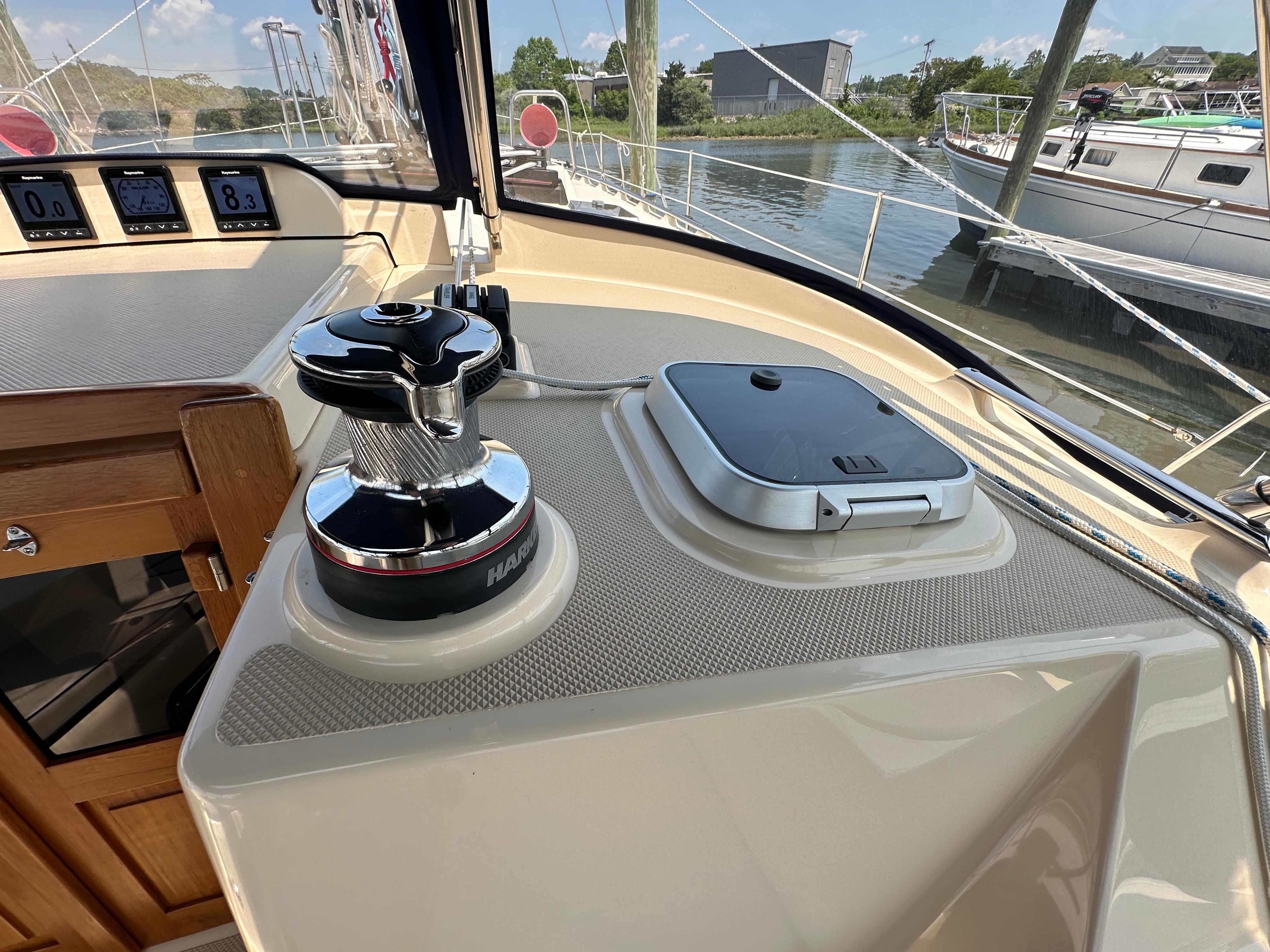 Cockpit of 2021 Island Packet 439 sailboat with winch and navigation instruments.