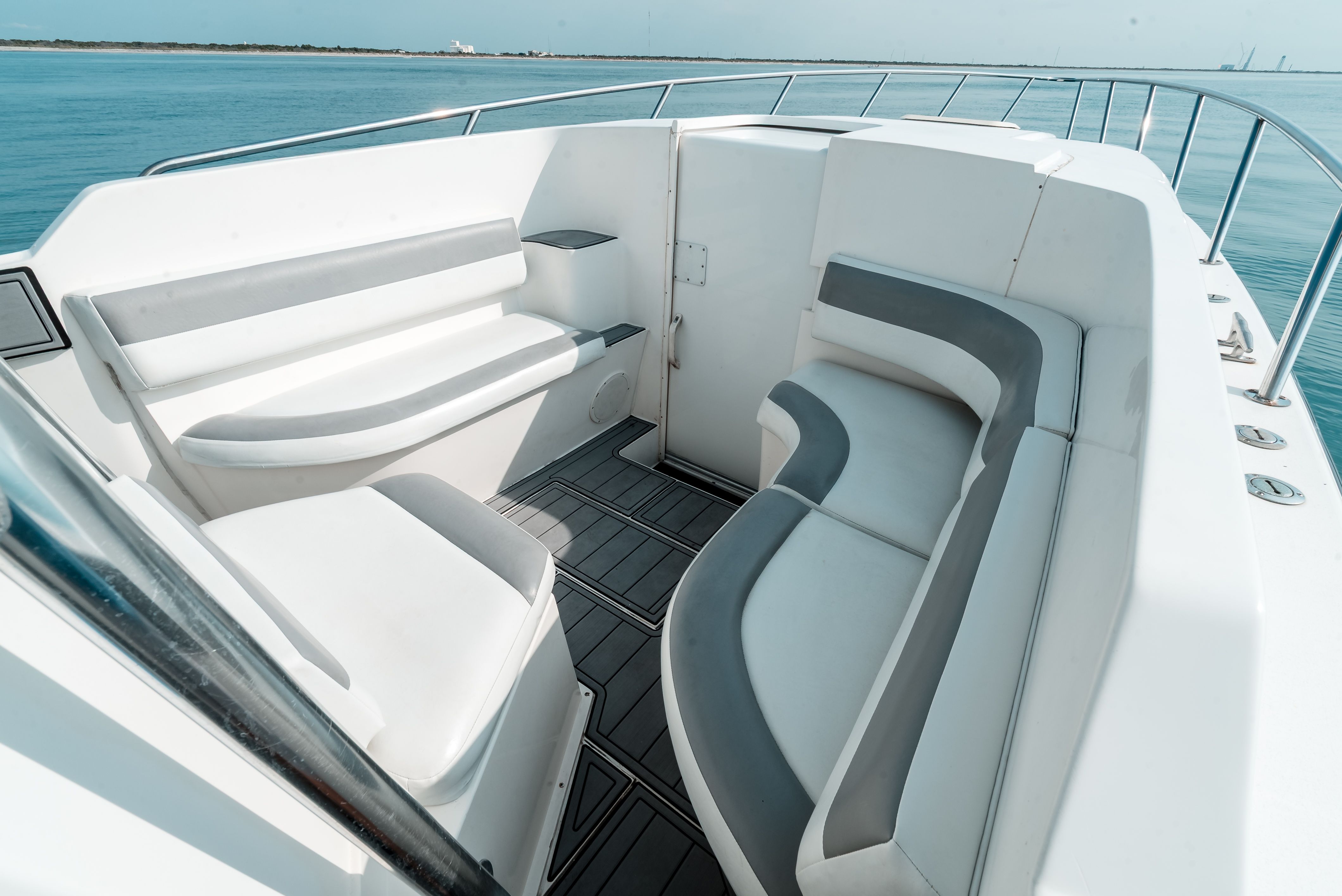 The image shows the cockpit of a 2006 Tempest Offshore 40 boat with white and gray seating.