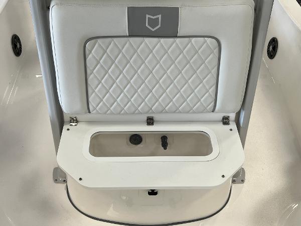 2024 Sea Fox 231 Bay boat seat with storage compartment.