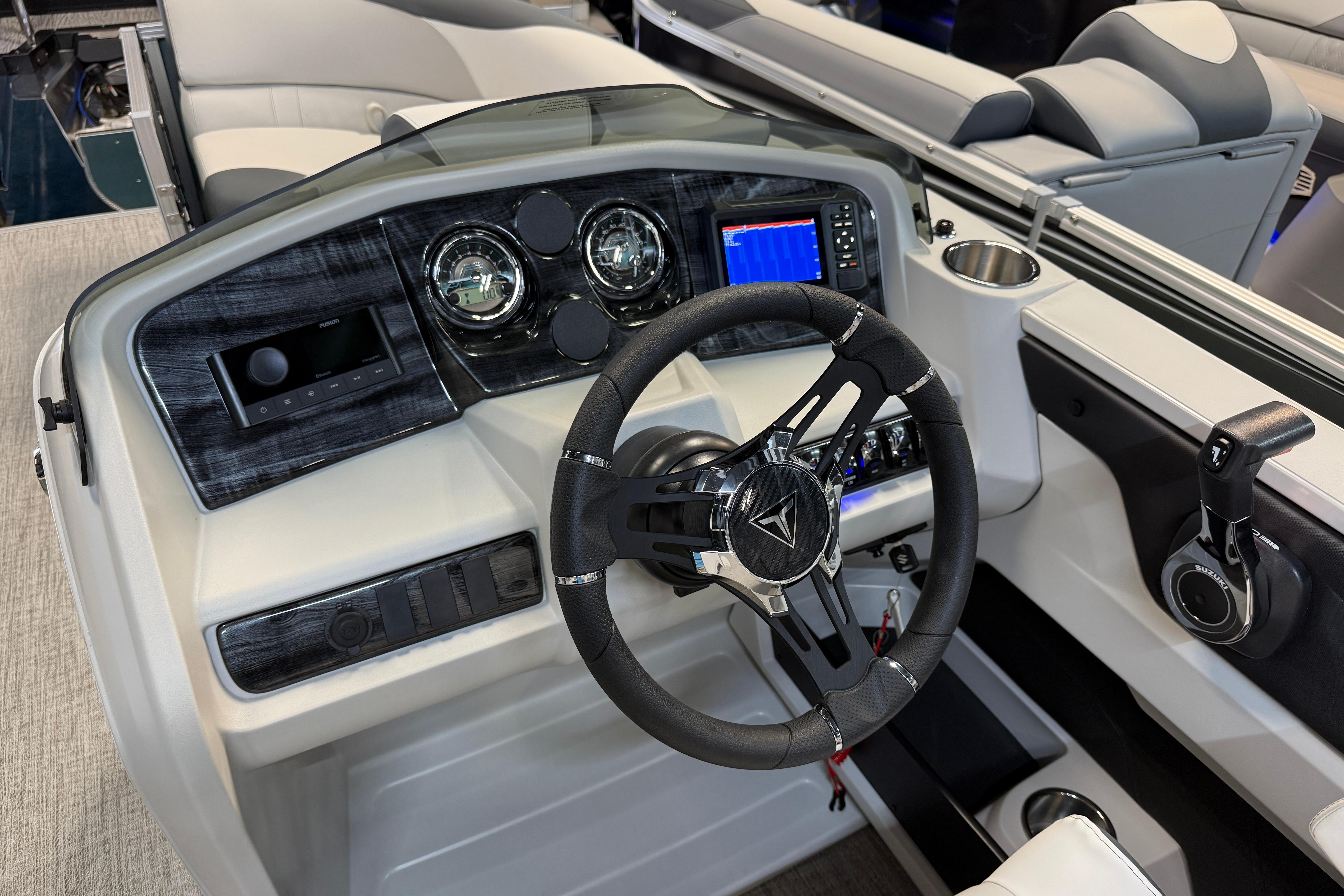 2026 Tahoe Pontoon LTZ Quad Lounger dashboard with modern steering and controls.