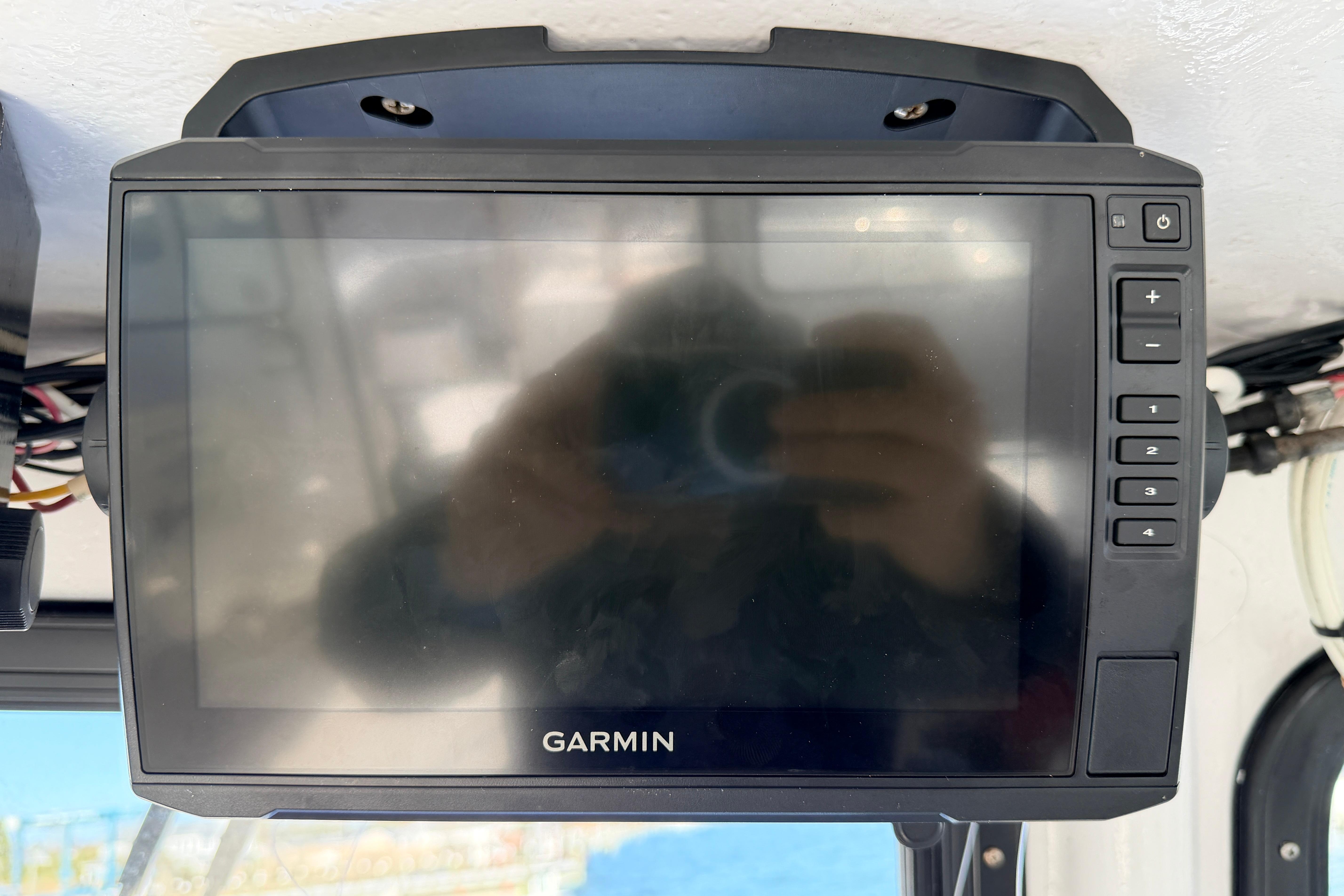 Garmin marine GPS device on a 1997 H&H Marine 38 boat dashboard.