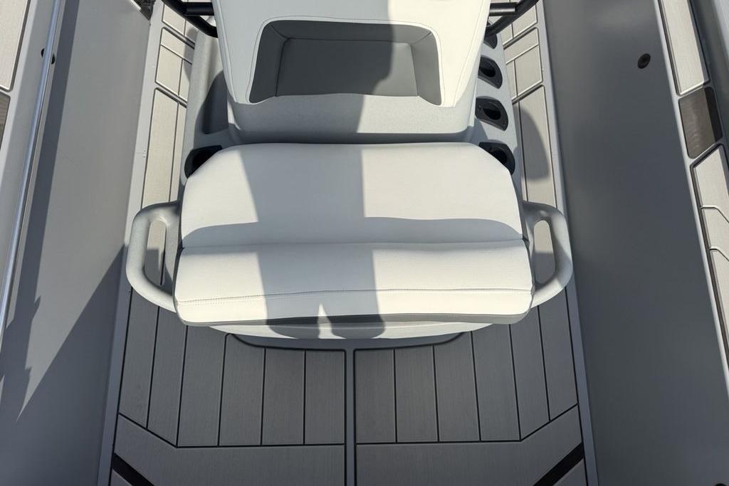 2026 Tracker Bass Tracker Classic CC boat interior with white seating and gray flooring.
