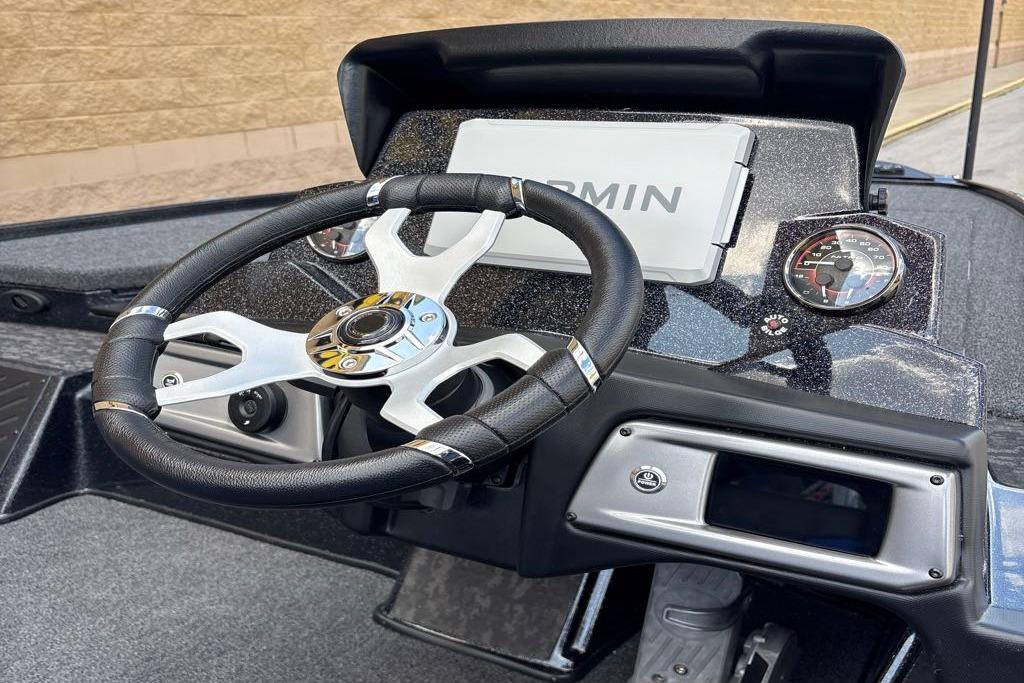 Steering wheel and dashboard of 2026 Nitro Z20 XL Pro boat with Garmin display.