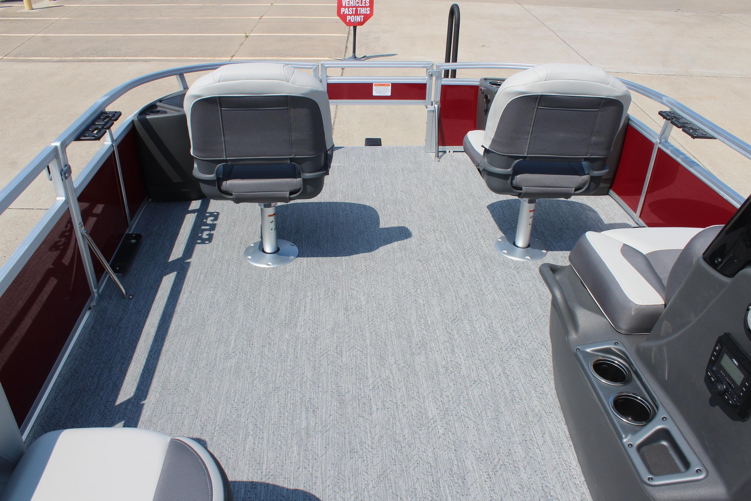 2026 Sun Tracker Bass Buggy 18 DLX pontoon boat interior with seating and console.