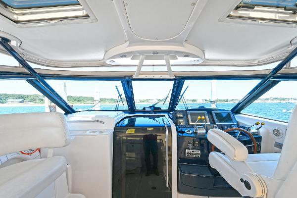 2008 Tiara Yachts 4200 Open helm with modern controls and panoramic windows.