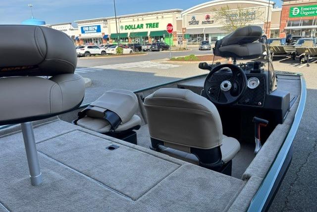 2026 Tracker Bass Tracker Classic Limited boat interior in a shopping center parking lot.