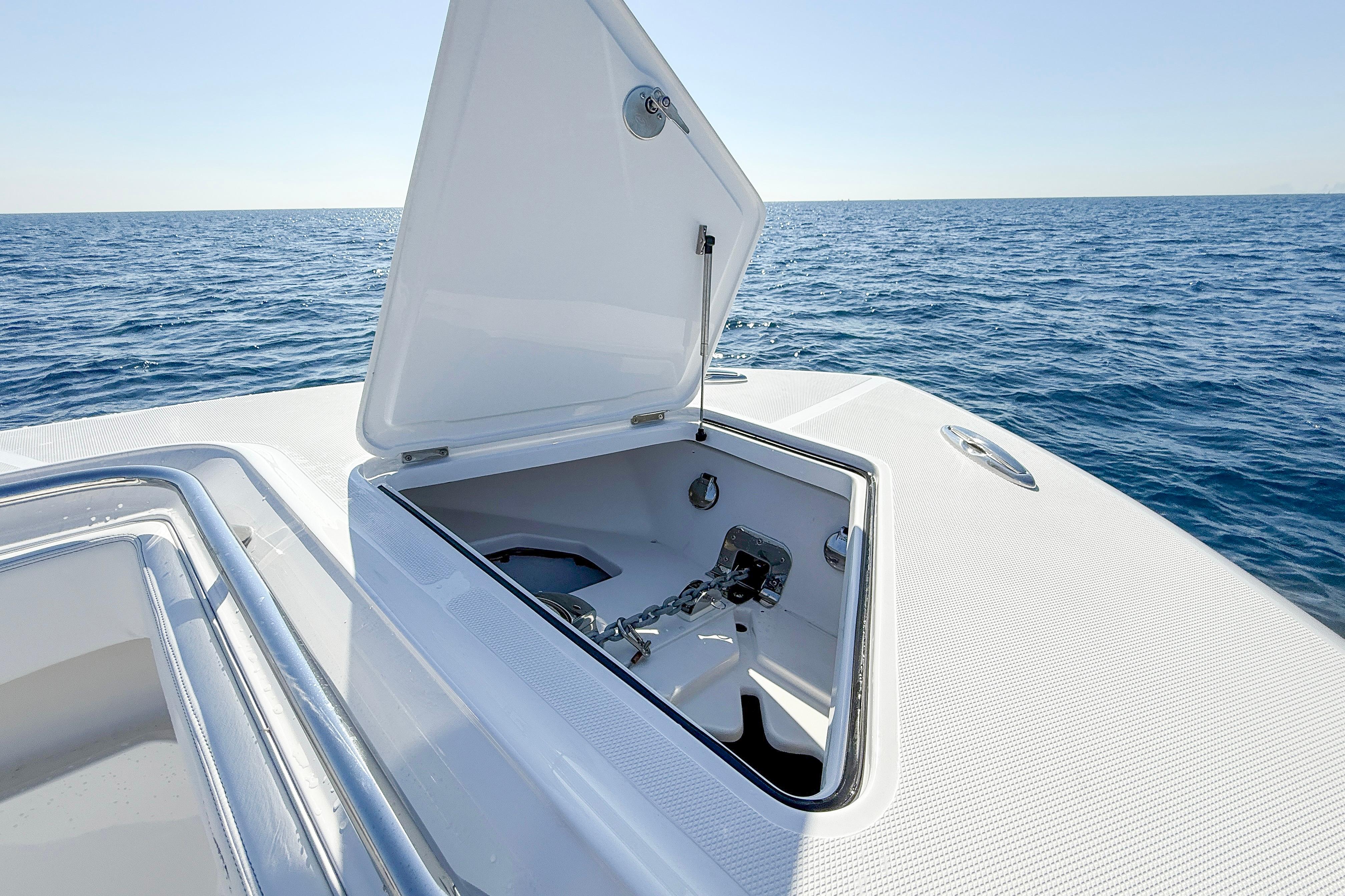 Open anchor compartment on 2026 Blackwater 41 Sportfish boat, ocean background.