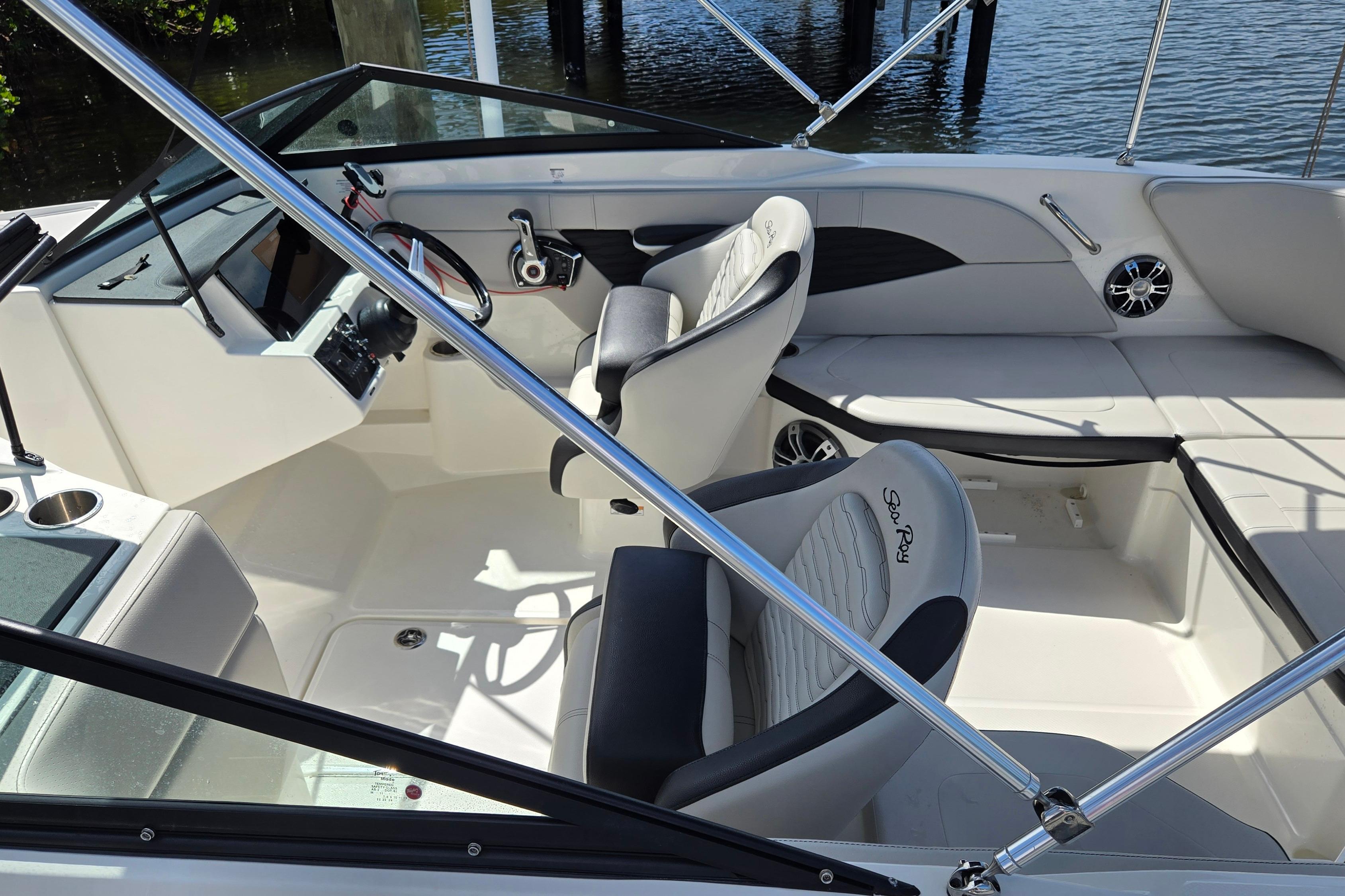 2023 Sea Ray SPX 210 boat interior with modern seating and steering console.