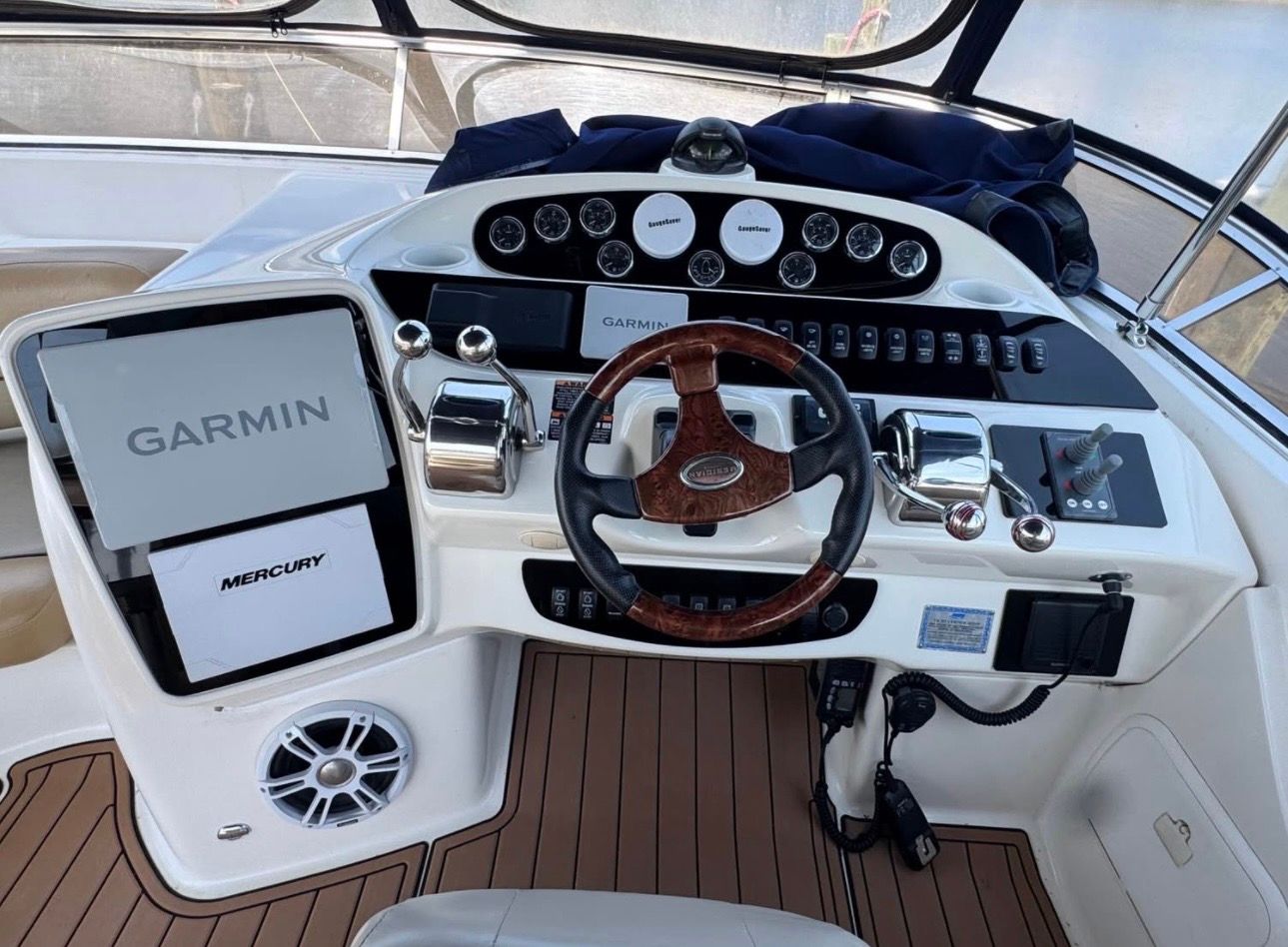 2007 Meridian 411 Sedan helm with Garmin and Mercury equipment.