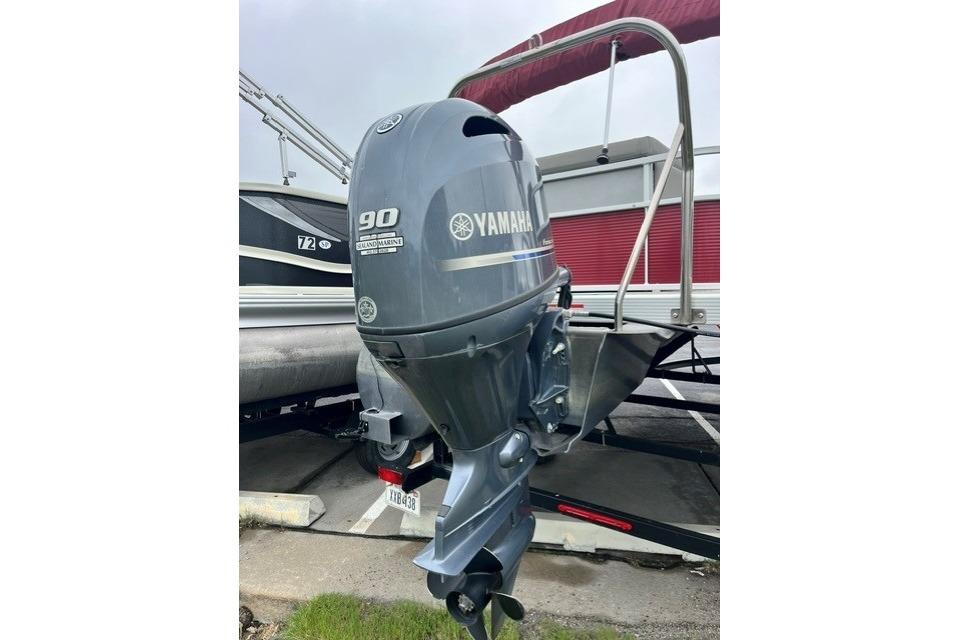 2021 Bennington 205SL with Yamaha 90 outboard motor, parked on a trailer.
