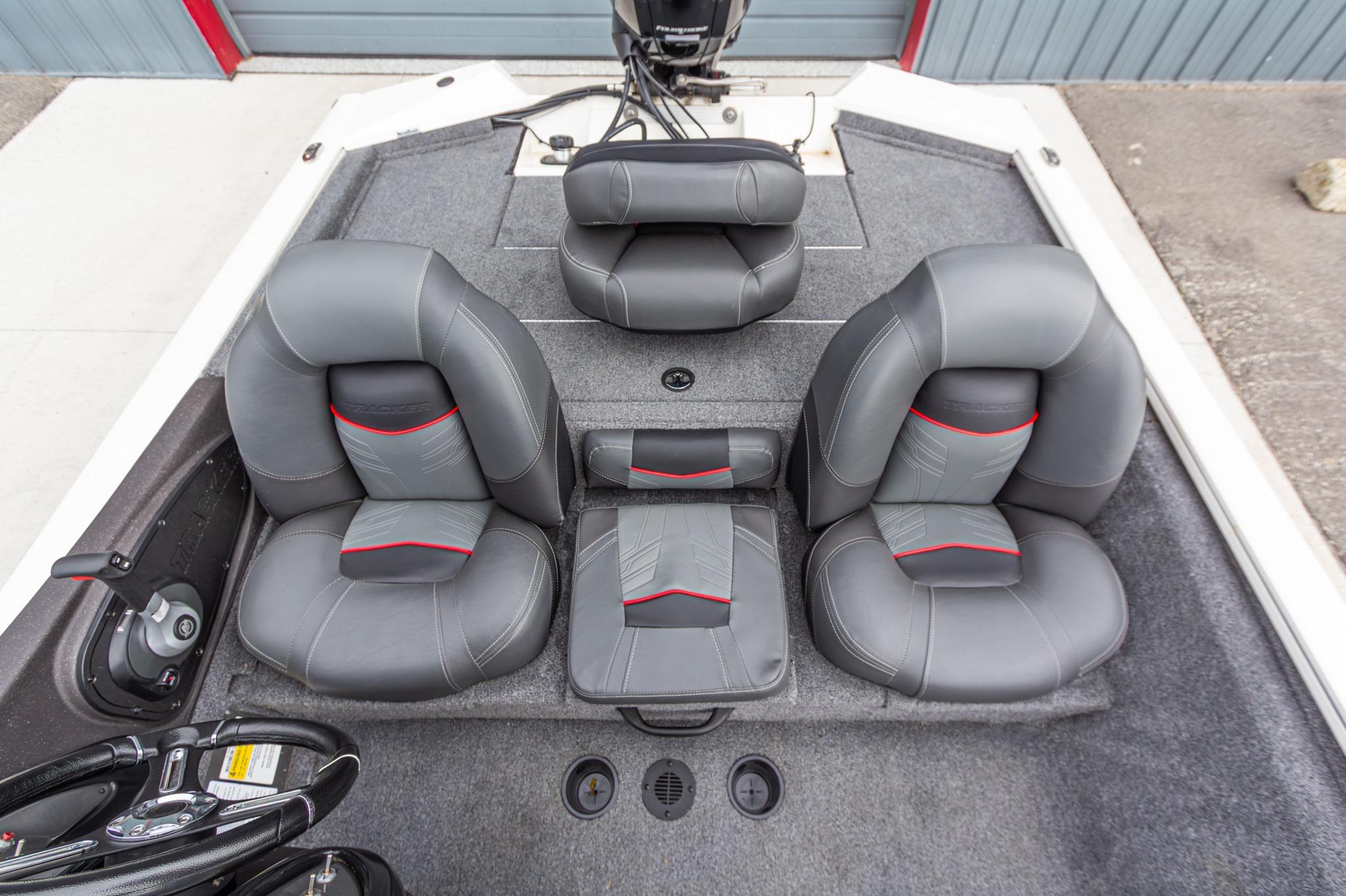 2023 Tracker Pro Team 190 TX boat interior with gray and red cushioned seats.