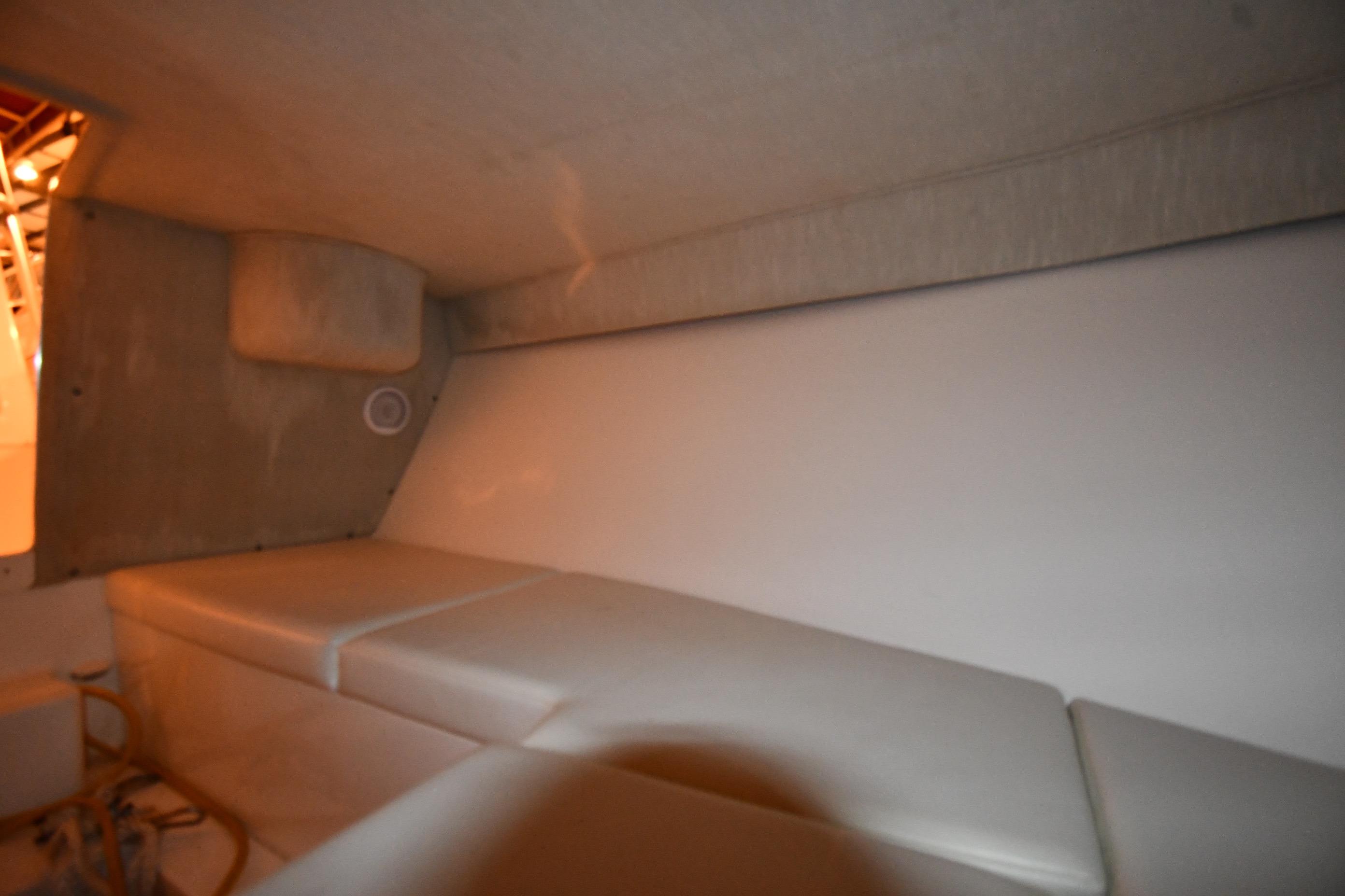 2001 Fountain 38 Center Console cabin interior with cushioned seating.