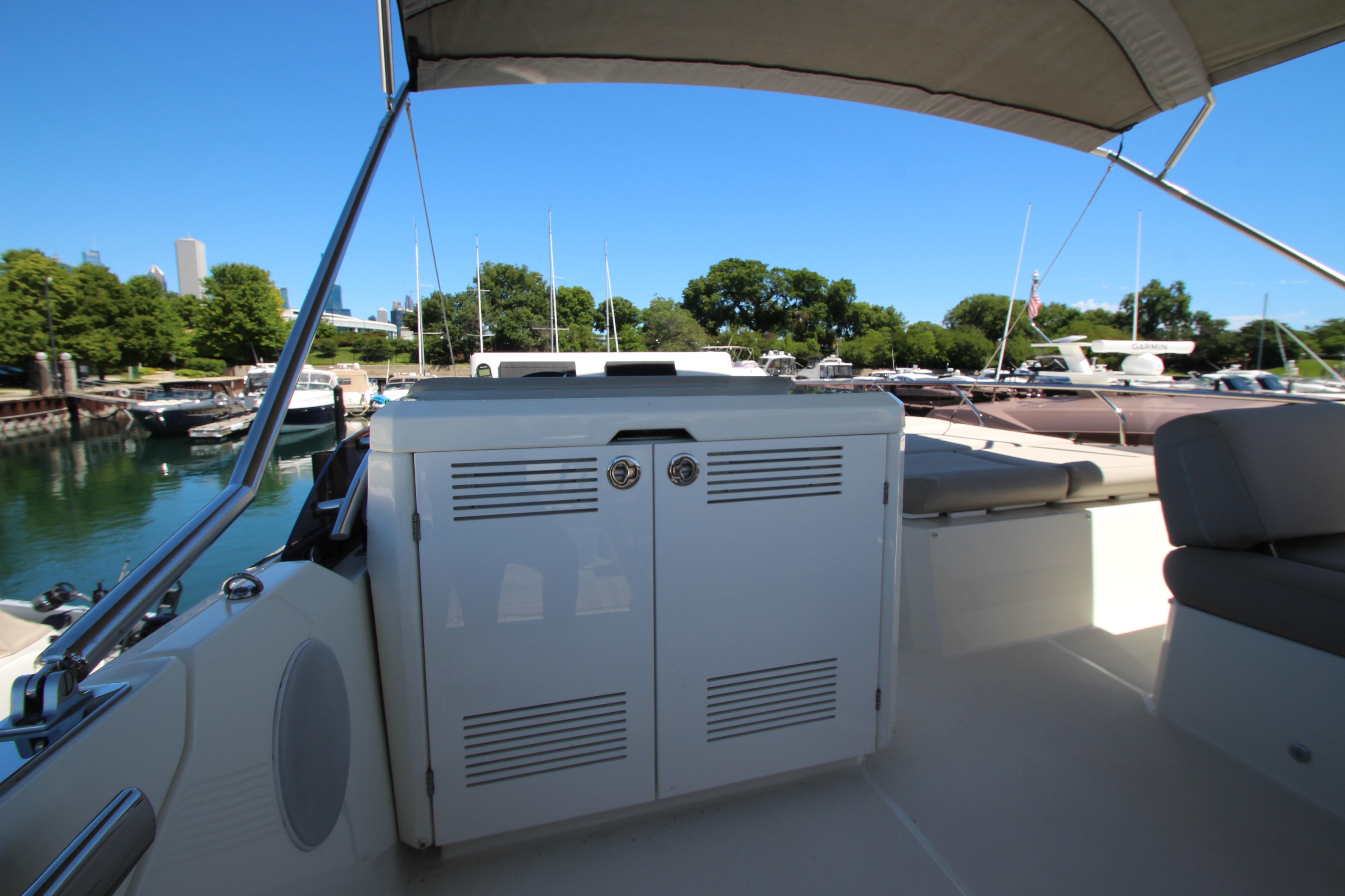 Prestige 520 yacht interior, 2022 model, docked in a scenic marina setting.