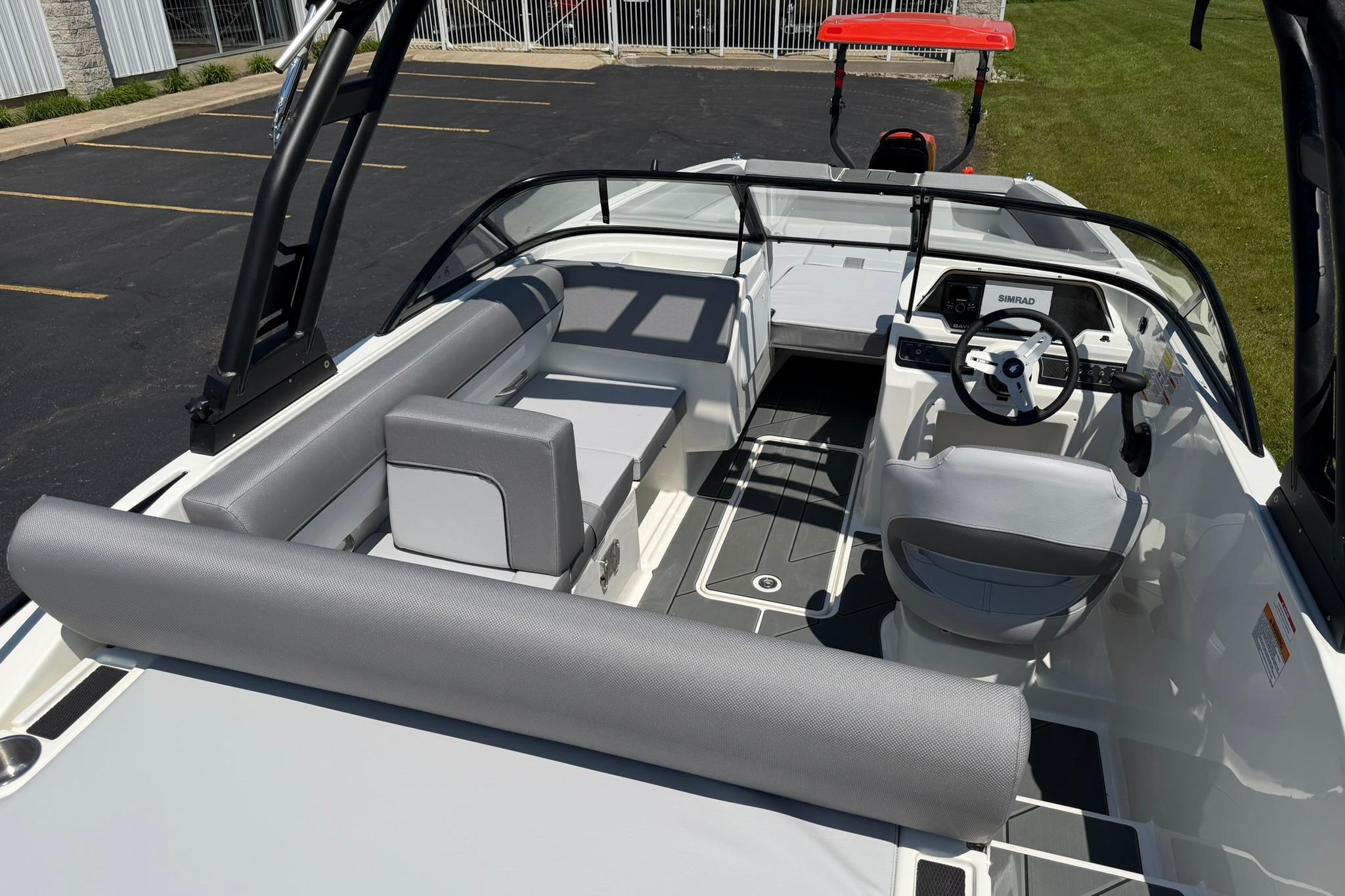 2026 Bayliner D20 boat interior with modern seating and steering console.