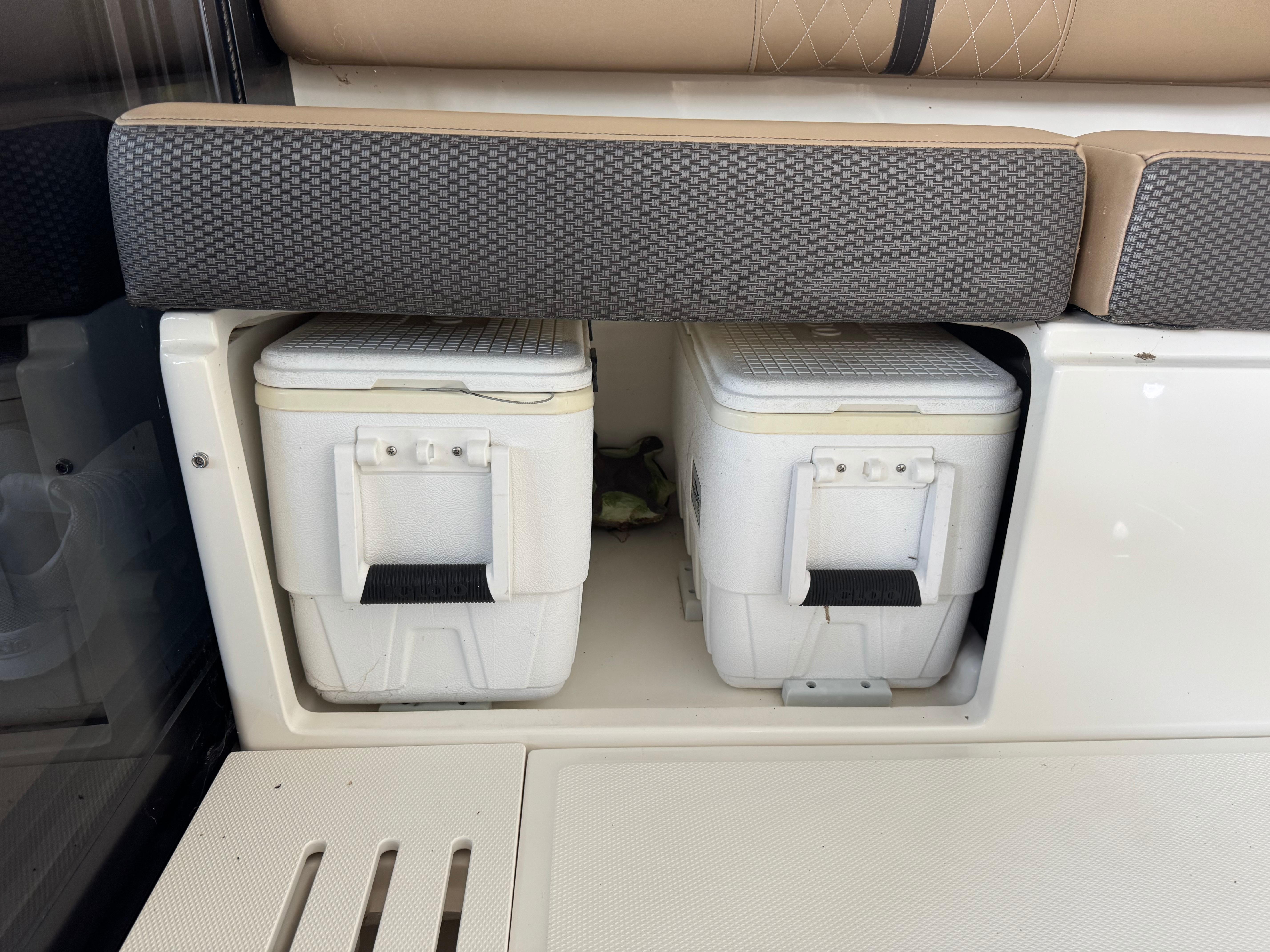 Storage compartment with coolers on a 2017 Sea Ray Sundancer 400 boat.