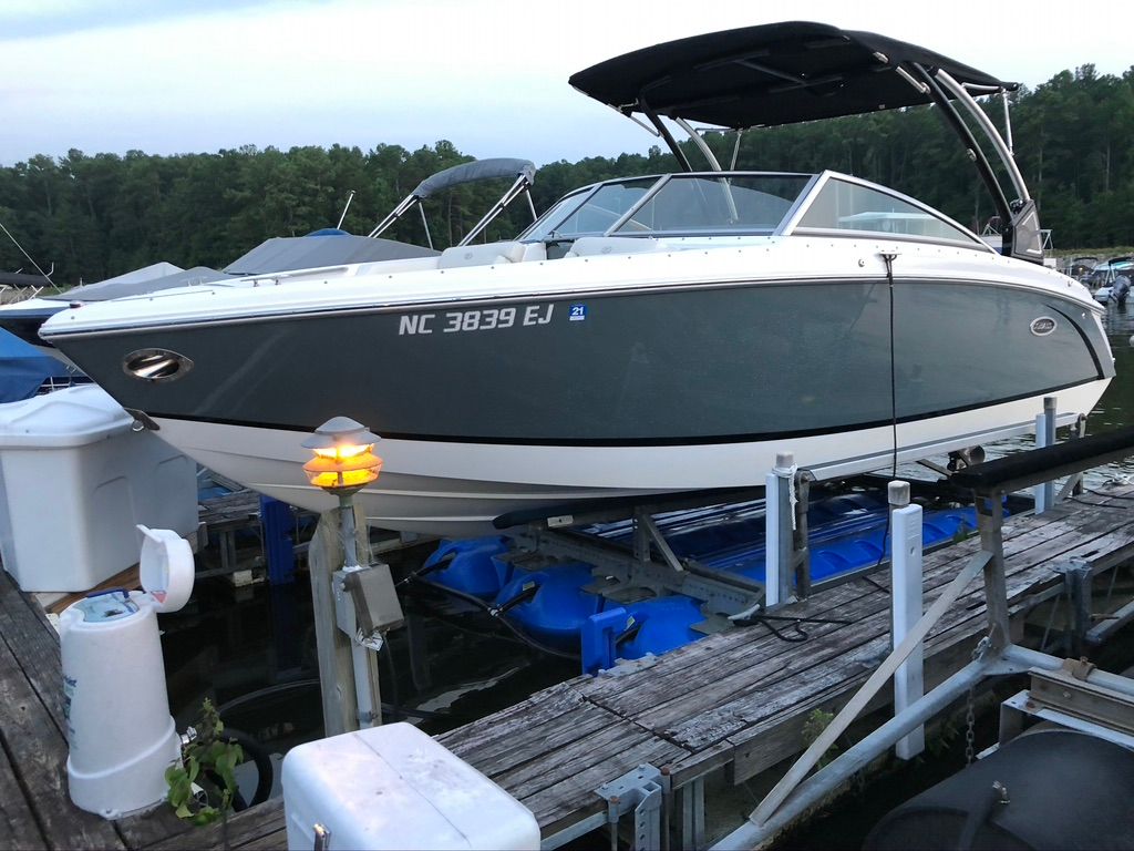 2017 Cobalt R5 boat docked at sunset.