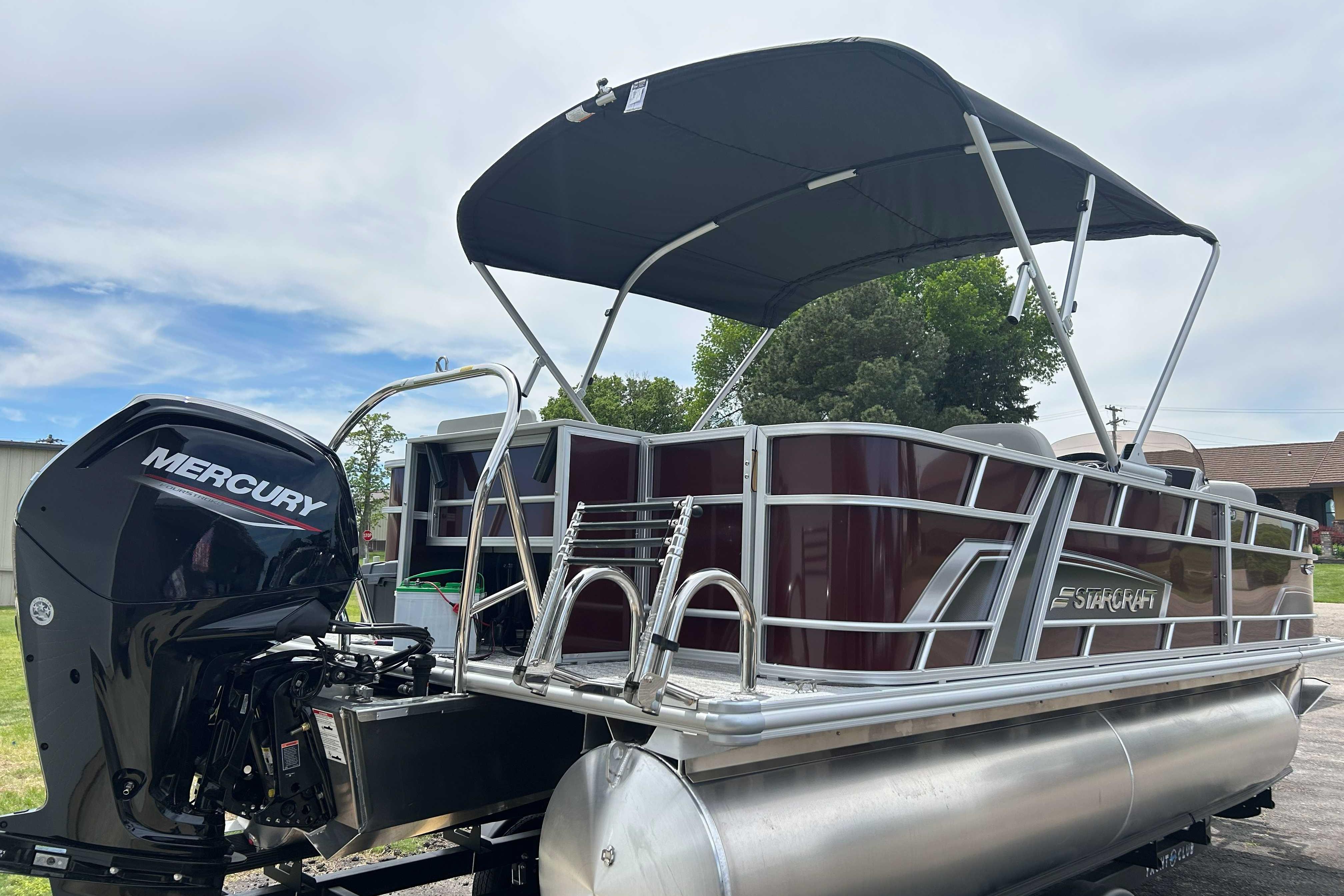 2026 Starcraft EX 20 F pontoon boat with Mercury outboard motor and canopy.