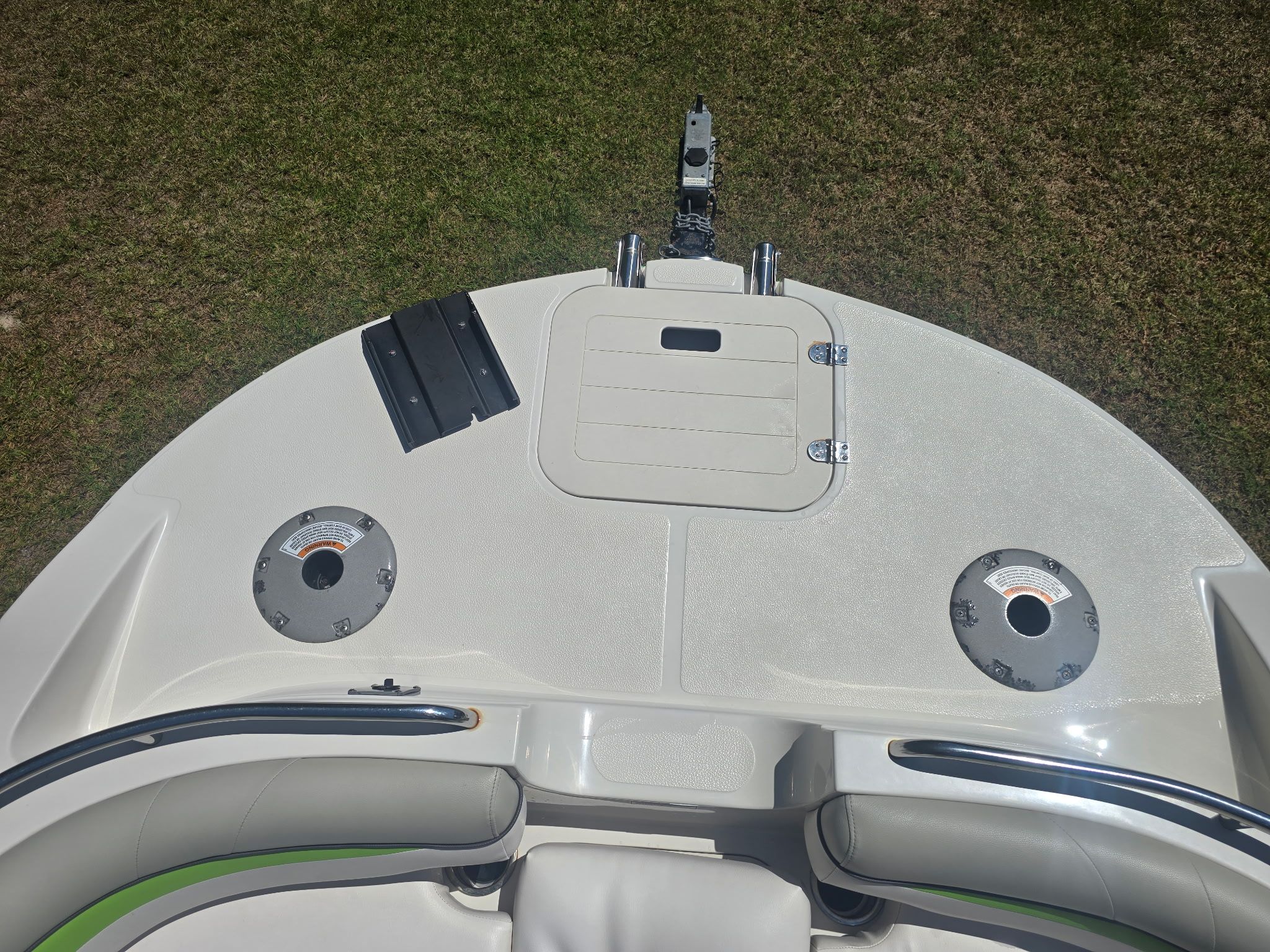 Top deck of a 2017 Starcraft MDX 191 OB with seating area and storage compartment.