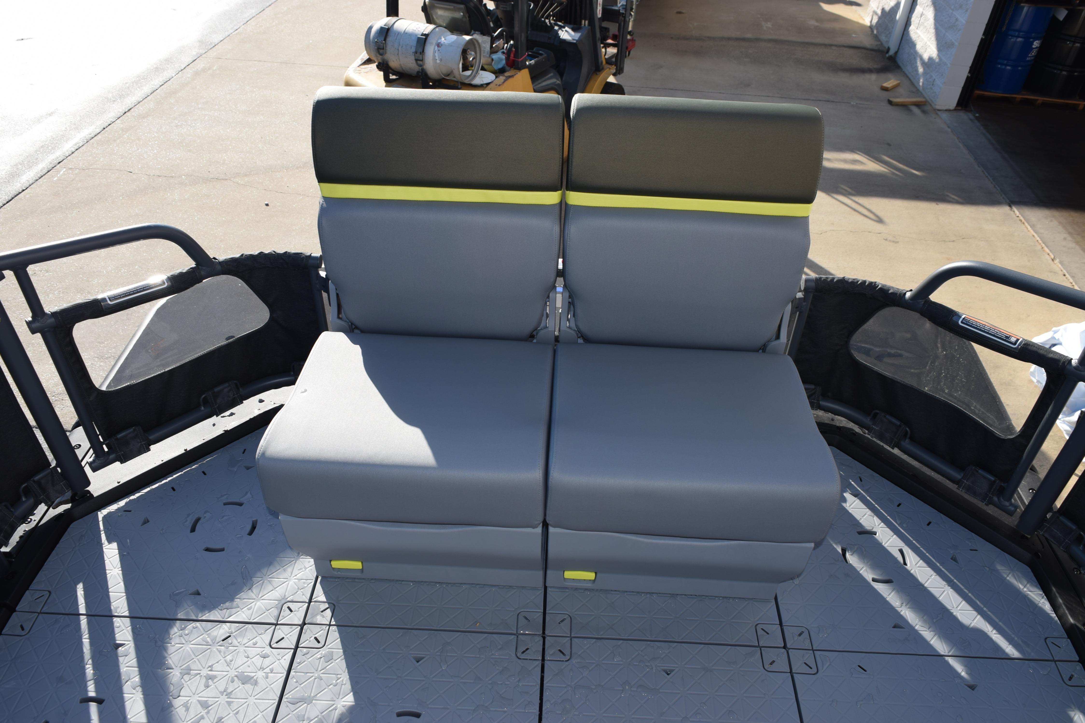 2026 Sea-Doo Switch Fish 21 boat seating area with gray and yellow cushioned seats.