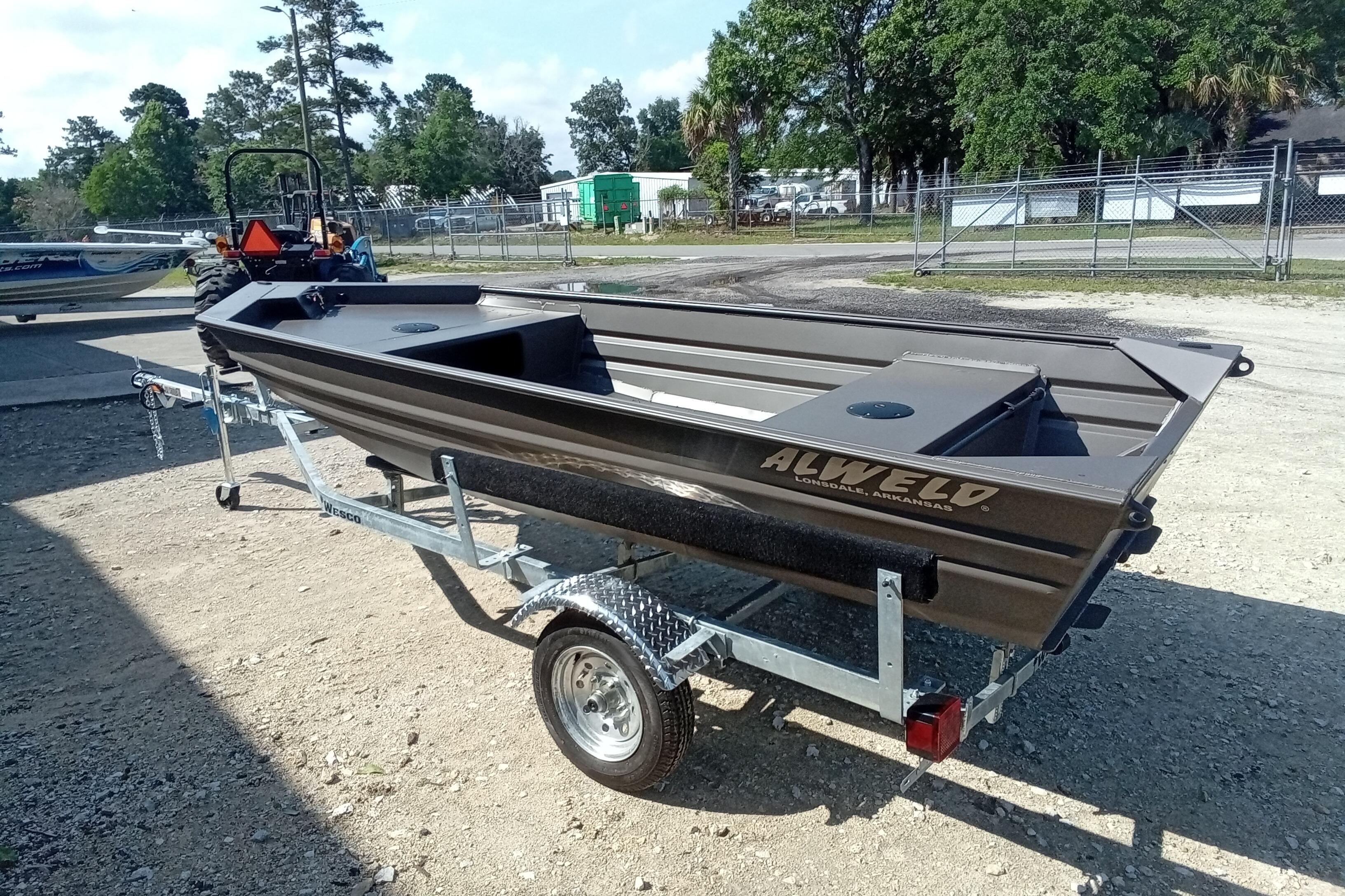 2026 Alweld 1448VV Vee Bottom boat on trailer, parked outdoors.
