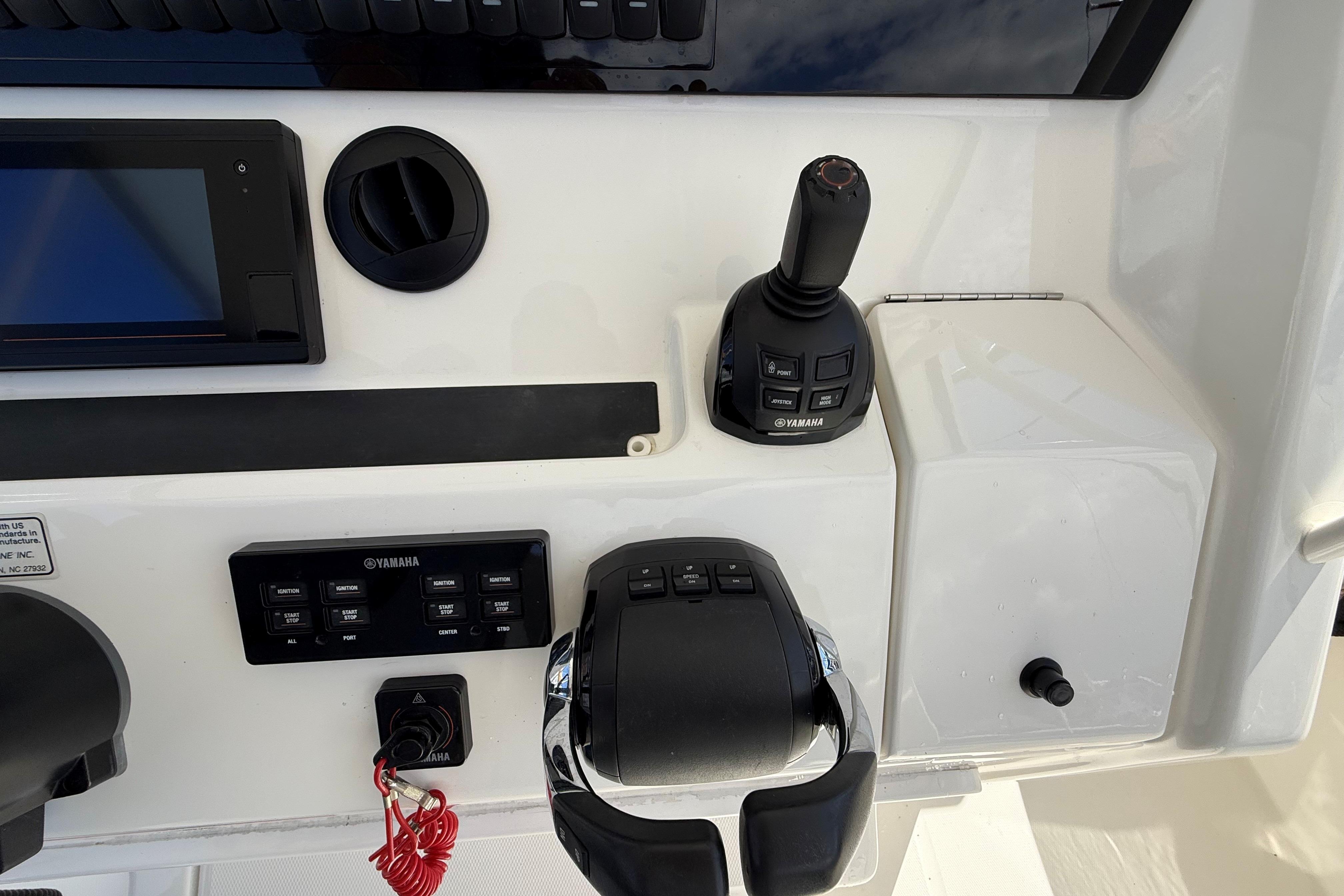 Control panel of a 2019 Regulator 34SS boat featuring Yamaha controls and joystick.