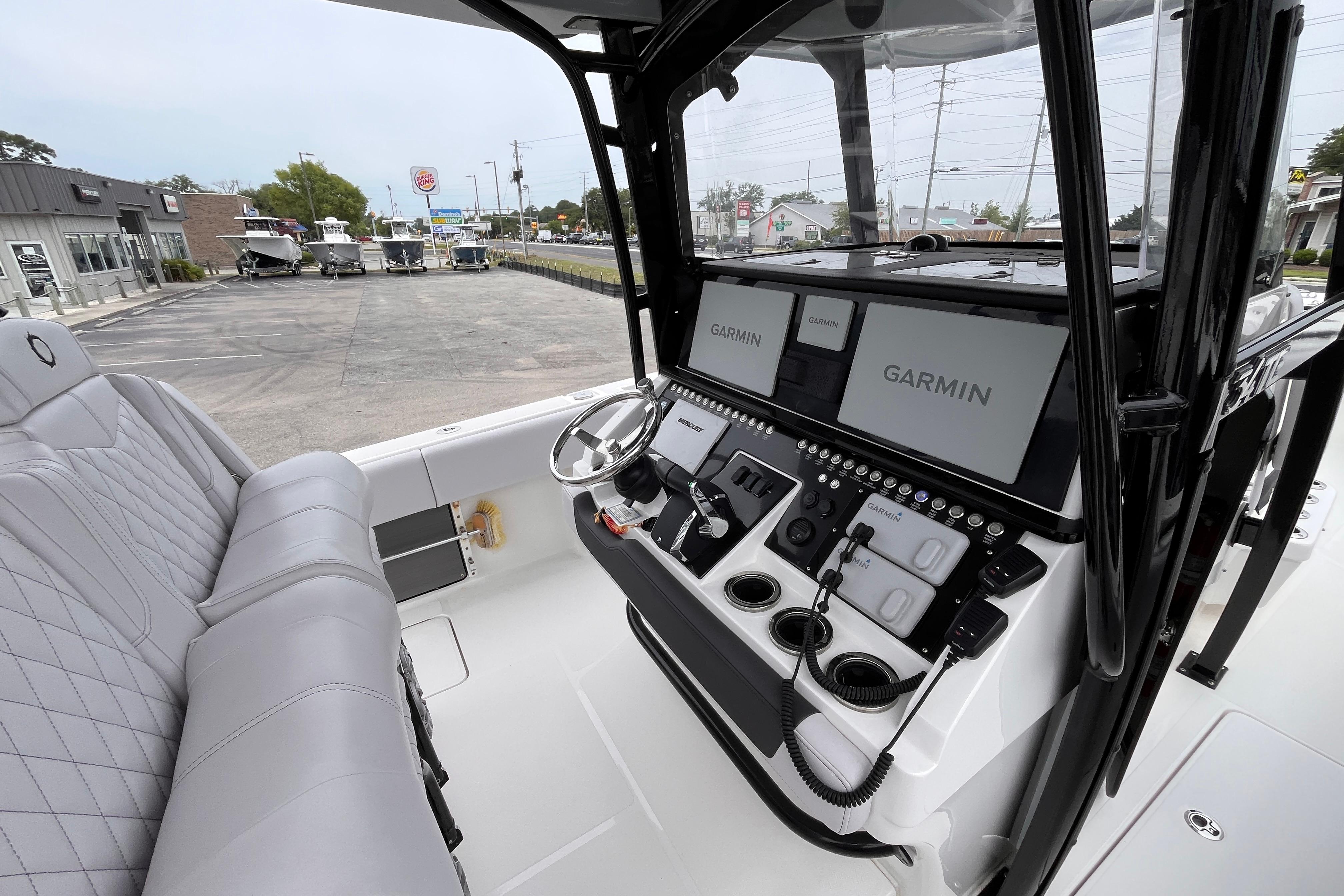 2024 Fountain 34 Tournament Edition boat cockpit with Garmin navigation displays and luxurious seating.